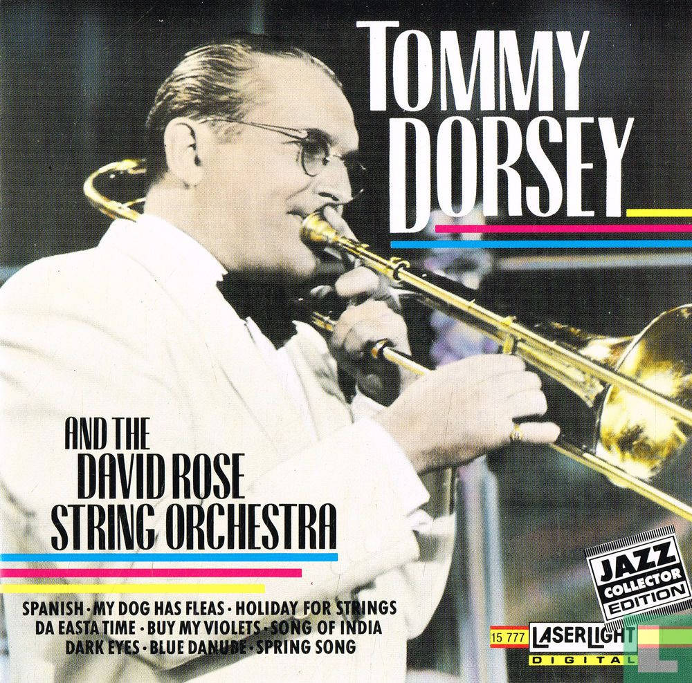 album 桌布 壁紙 — 一張復古爵士專輯封面，Tommy Dorsey 身穿白色西裝演奏長號，配有粗體文字和彩色條紋。