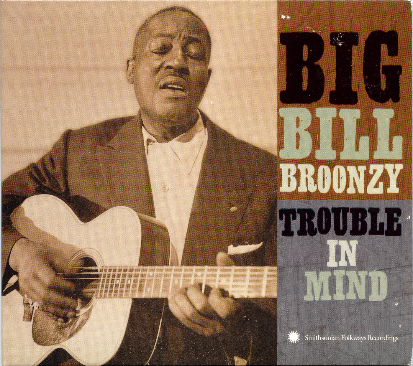 poster 桌布 壁紙 — 一張復古色調的照片，藍調音樂家Big Bill Broonzy熱情地彈奏木吉他並唱歌。