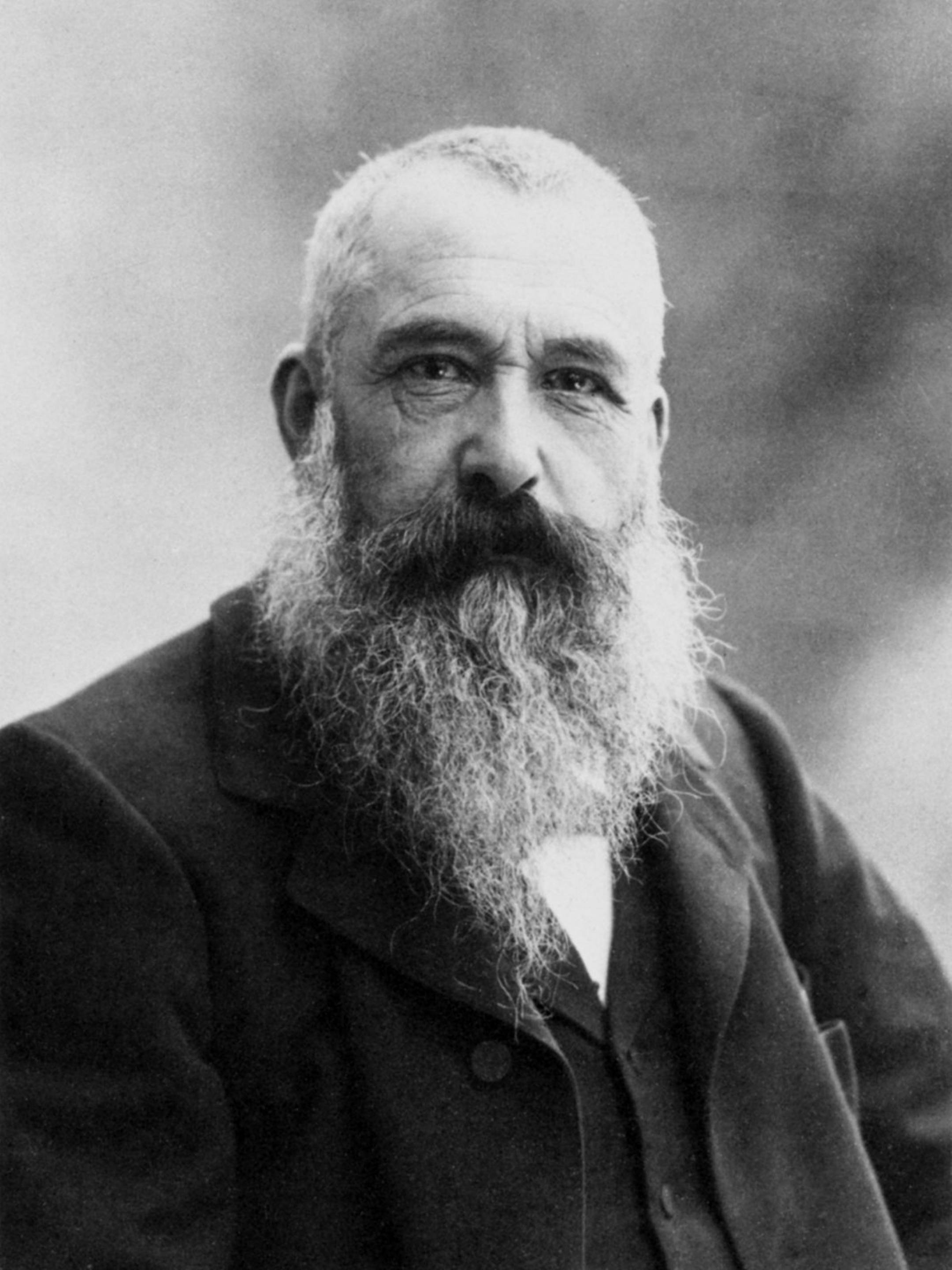 Monet 桌布 壁紙 — 一張復古黑白肖像，一位留鬍鬚的男子穿著正式服裝直視鏡頭。