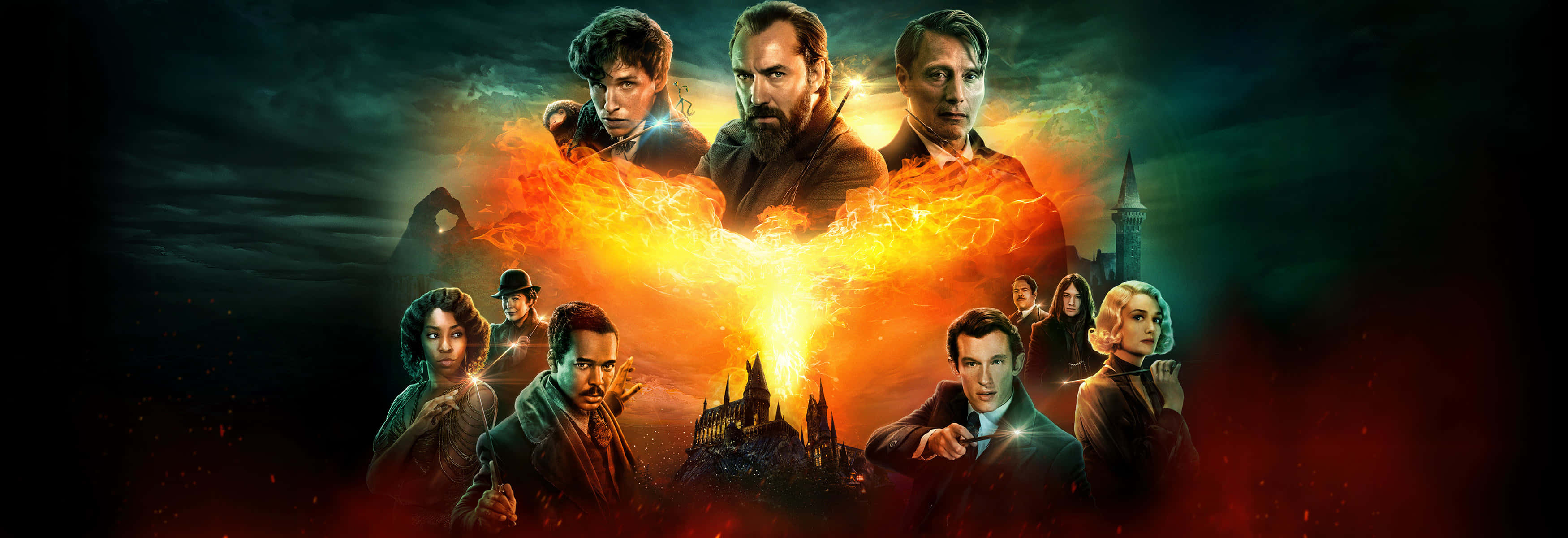 Fantastic Beasts 桌布 壁紙 — 一張戲劇性的奇幻電影海報，九個角色圍繞著哥德式城堡上方發光的火焰鳳凰。
