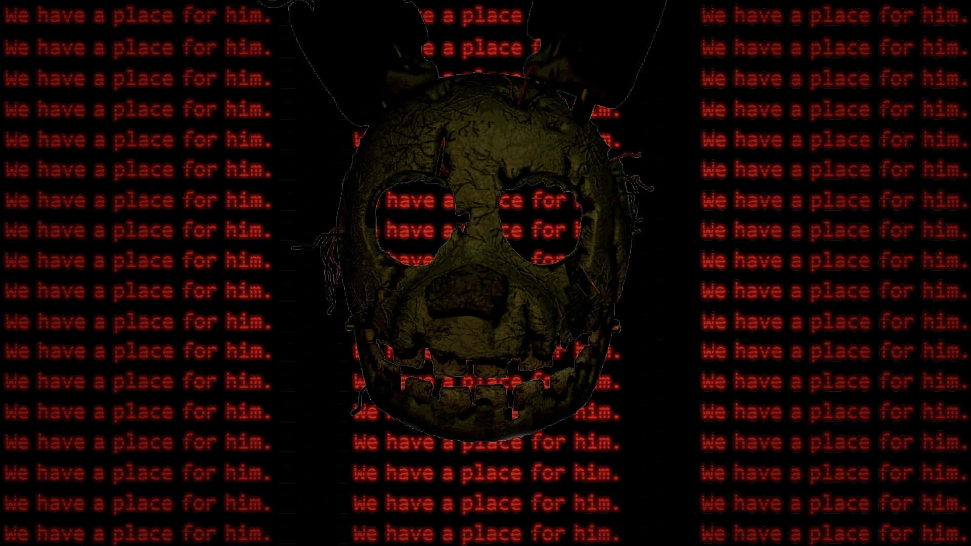 Springtrap 桌布 壁紙 — 一張扭曲、腐爛的臉從黑色背景中浮現，上面覆蓋著重複的紅色文字，寫著『我們為他準備了一個地方。』