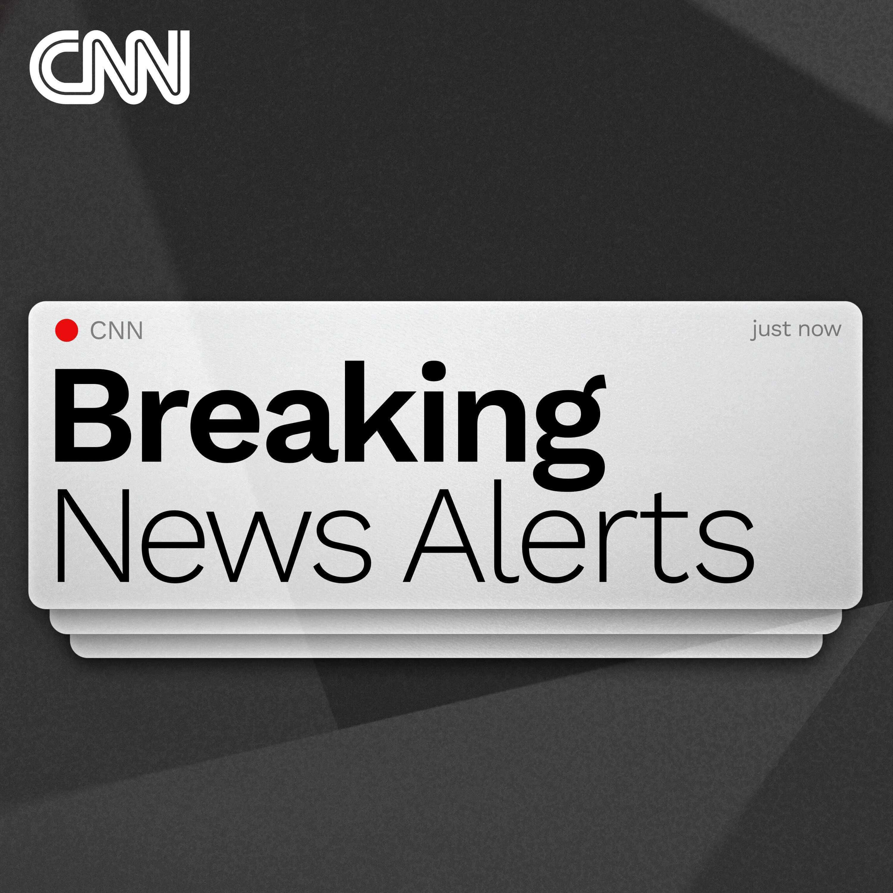 Cnn 桌布 壁紙 — 一張時尚的CNN突發新聞提示通知卡，在深色幾何背景上帶有粗體文字和紅點。