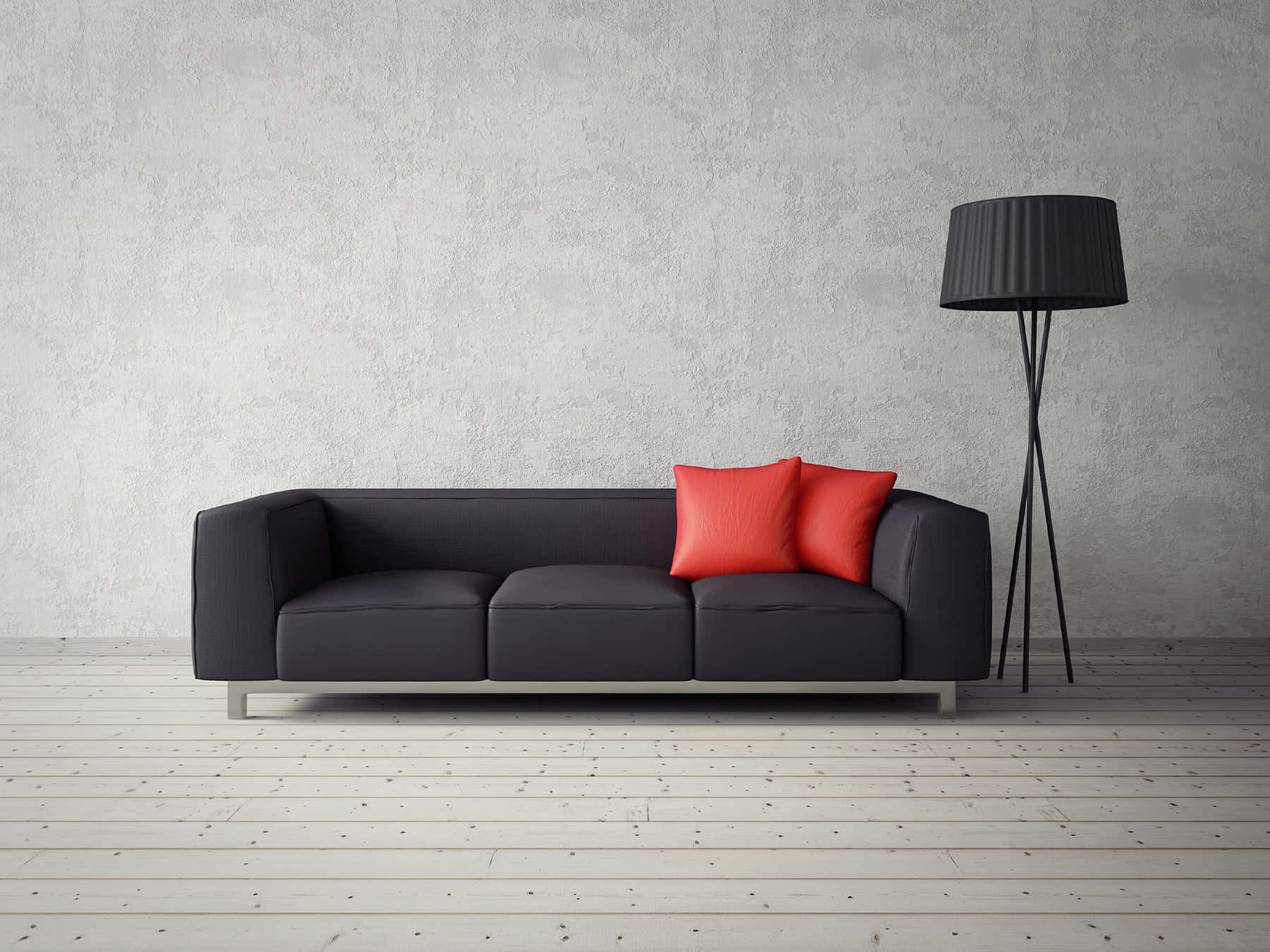 Living Room 桌布 壁紙 — 一張時尚的深灰色沙發，配以兩個鮮紅色靠墊，靠著紋理混凝土牆，旁邊有一盞黑色三腳落地燈，置於淺色木地板上。