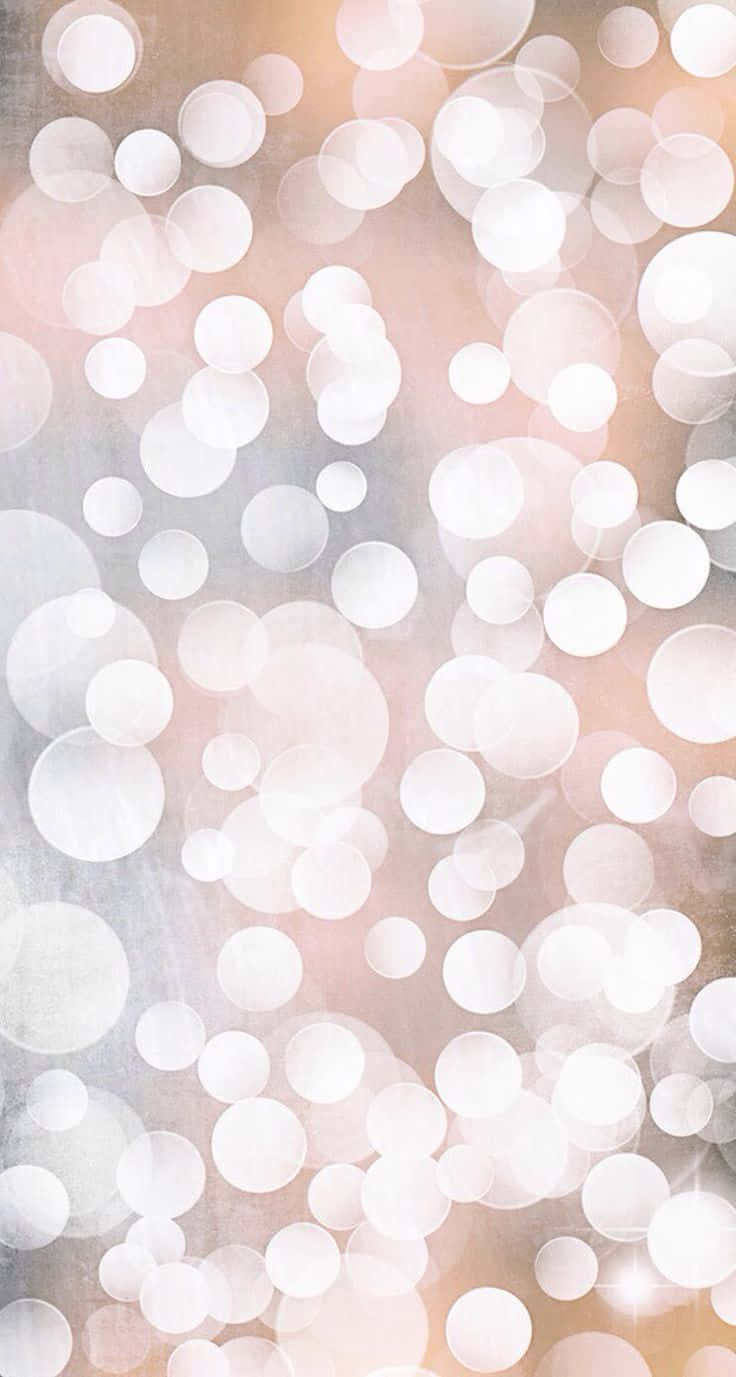 Bokeh 桌布 壁紙 — 一張柔和抽象的壁紙，上面有發光的白色散景圓圈，背景是柔和的粉紅色和灰色紋理。