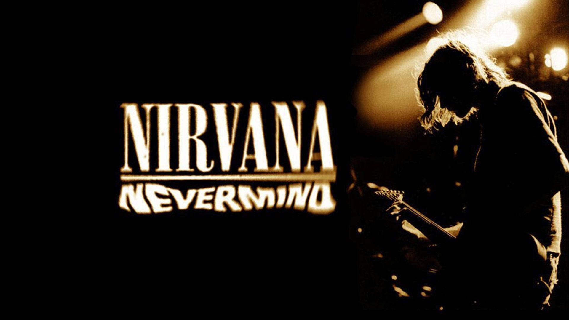 nirvana 4K 桌布 壁紙 — 一張棕褐色調的音樂會照片，吉他手在舞台燈光下形成剪影，'Nirvana Nevermind' 文字在黑暗中發光。
