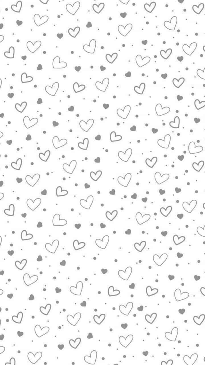 Cute Hearts 桌布 壁紙 — 一張極簡風格的桌布，白色背景上散落著灰色輪廓的心形和圓點。