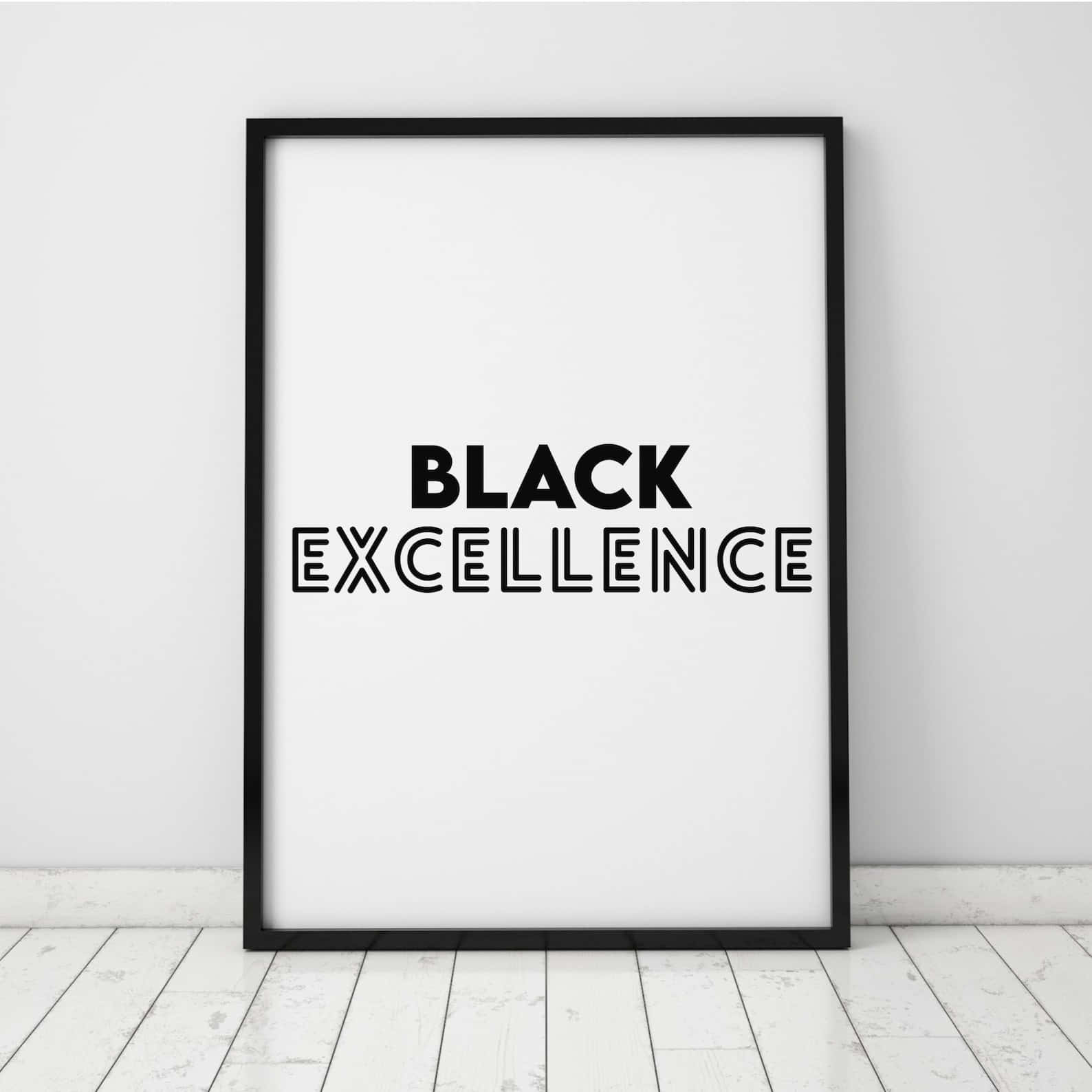 Black Excellence 桌布 壁紙 — 一張極簡風格的黑色邊框海報，上面以粗體字寫著「BLACK EXCELLENCE」，靠著白色牆壁，放在淺色木地板上。