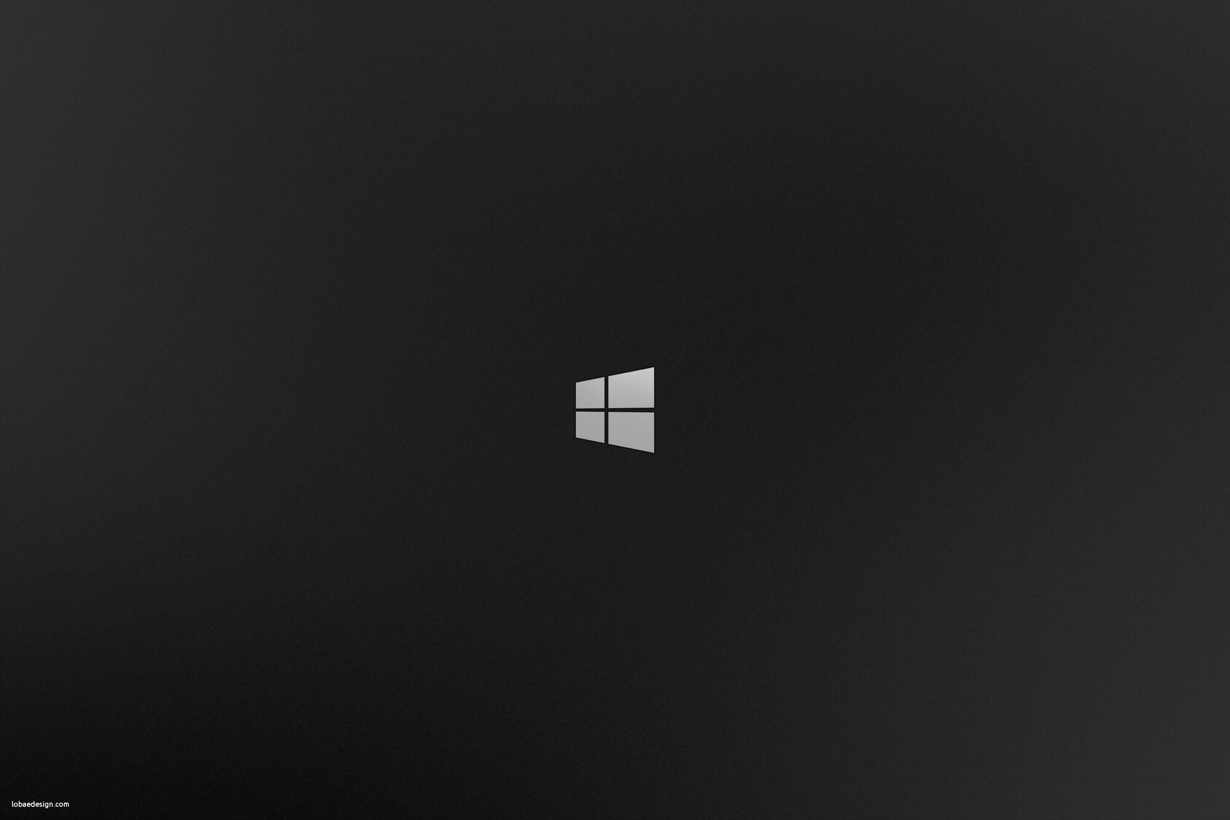 Windows 桌布 壁紙 — 一張極簡黑色桌布，中央帶有銀色Windows標誌，帶有微妙的漸變陰影。