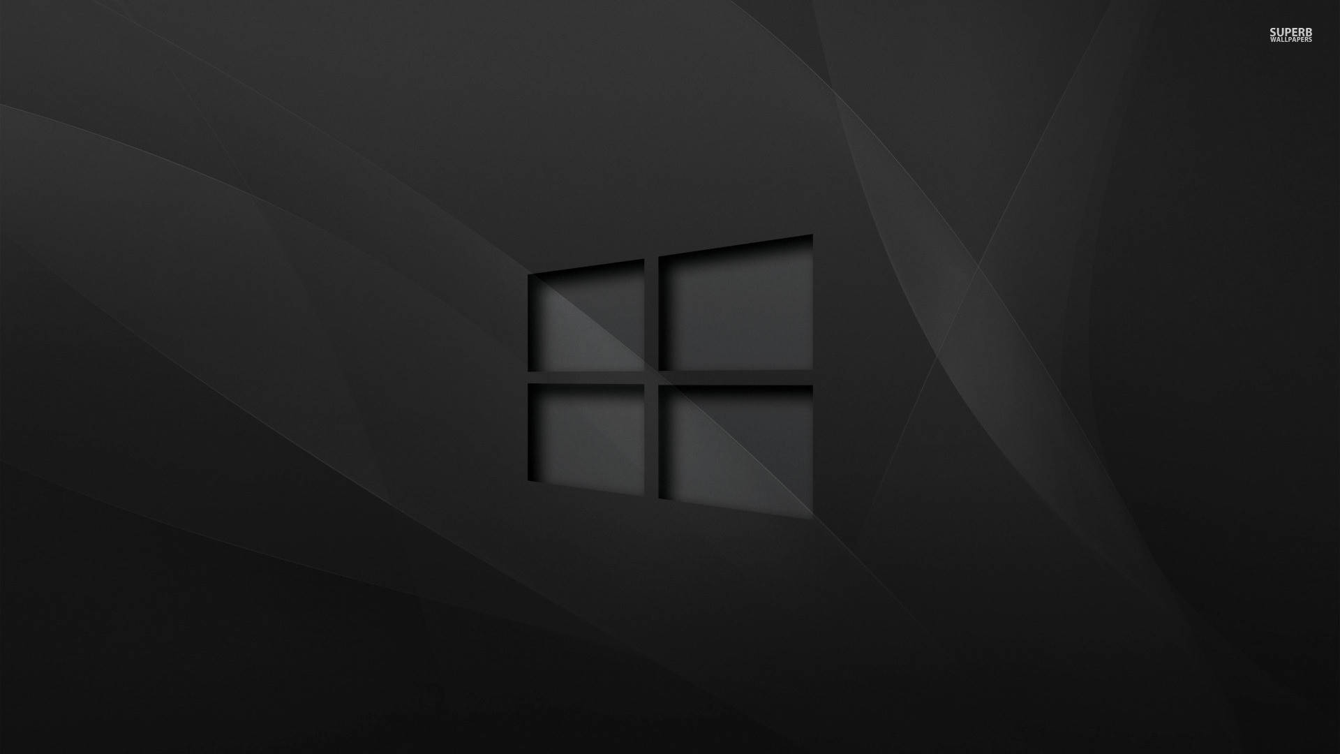 黑色 Windows 10 桌布 壁紙 — 一張極簡黑色桌布，中央有一個微妙的幾何Windows標誌，位於深色漸變背景上。