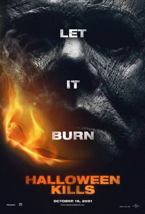 Halloween Kills 桌布 壁紙 — 一張燒傷臉部的威脅性特寫，火焰舔過嘴巴，文字寫著「LET IT BURN」和「HALLOWEEN KILLS」。