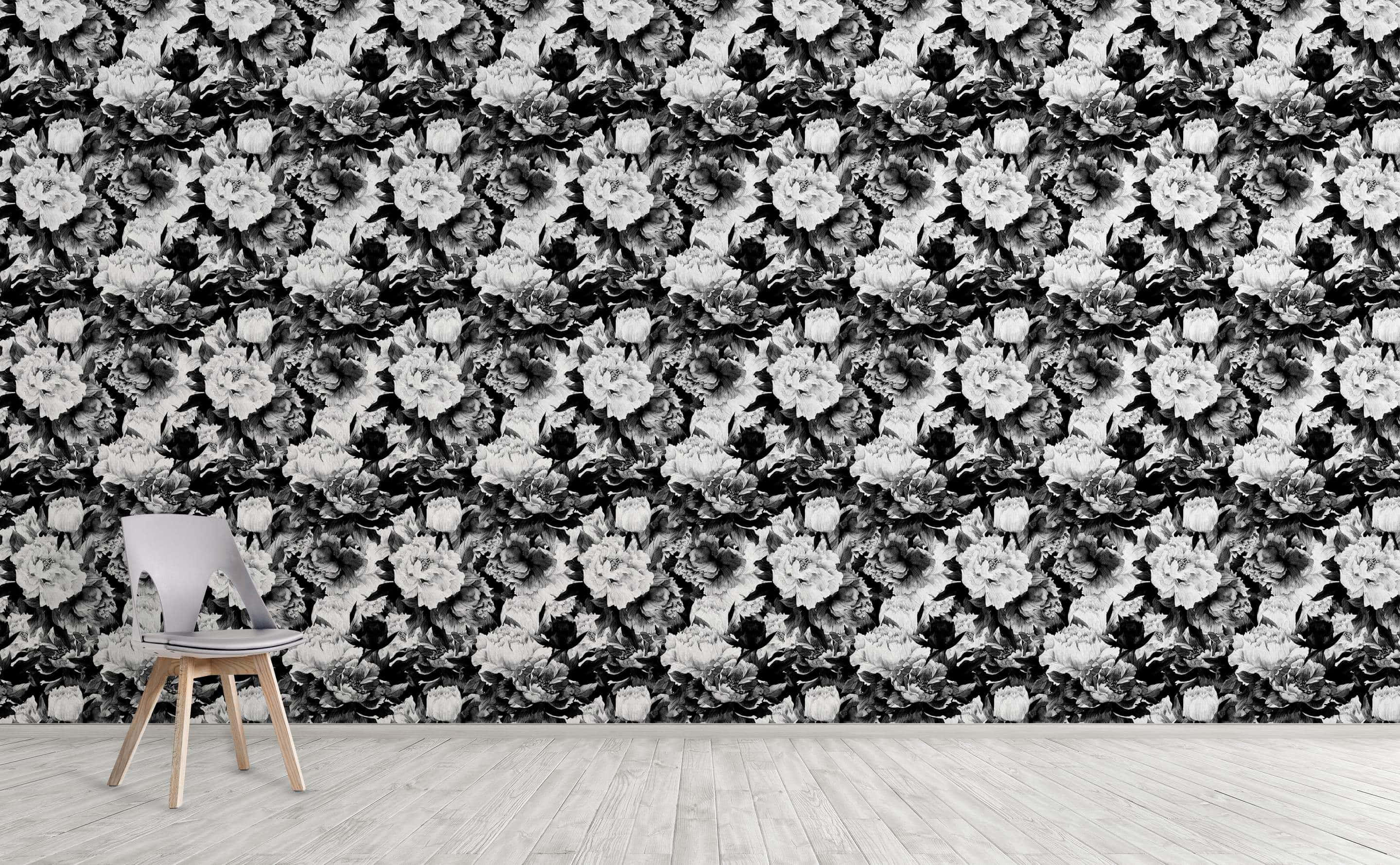 Black And White Pattern 桌布 壁紙 — 一張現代單椅放在鋪有密集黑白花卉壁紙的牆前，搭配淺色木地板。