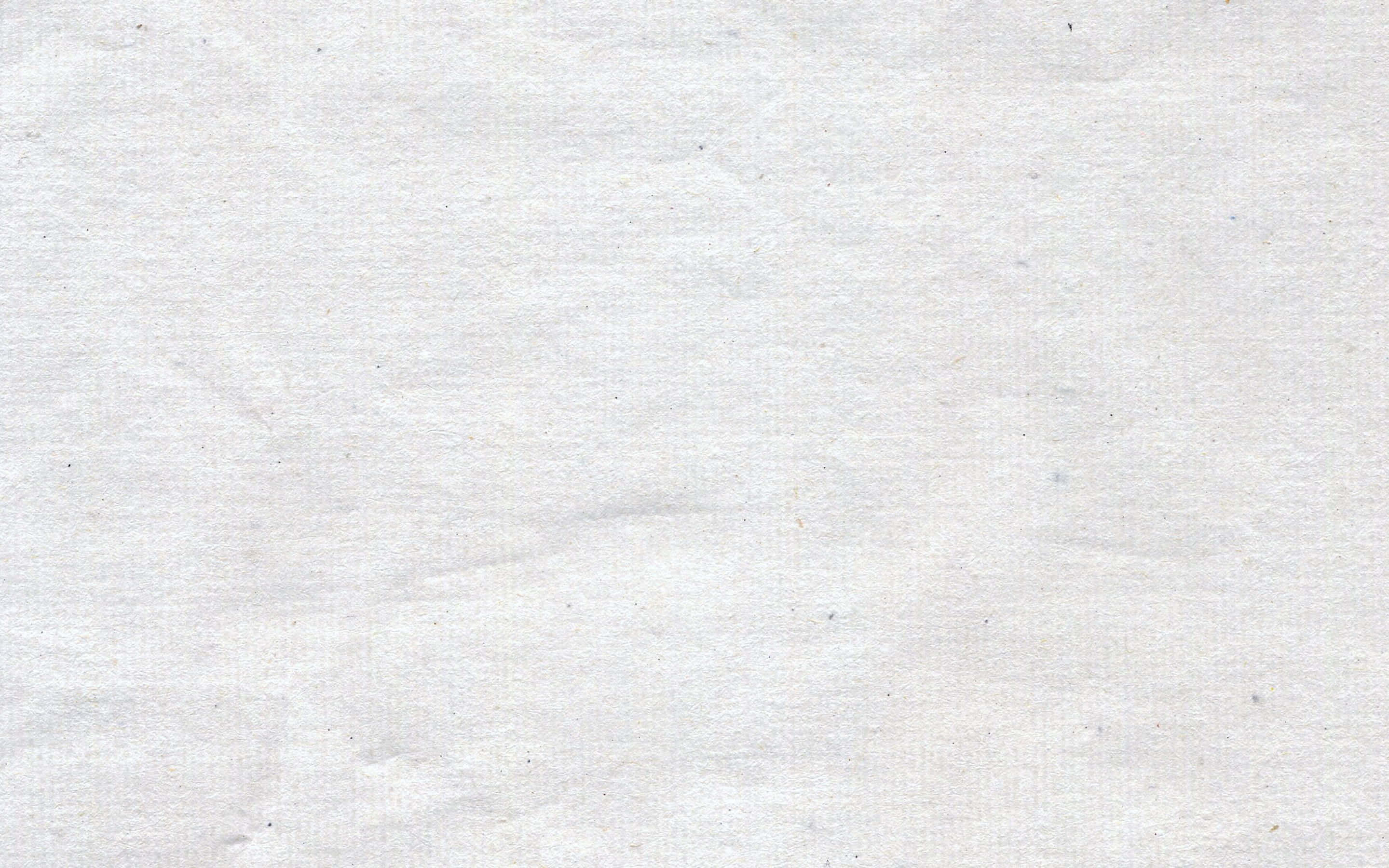 paper 桌布 壁紙 — 一張皺巴巴的白紙特寫，帶有細微紋理和淡淡斑點。