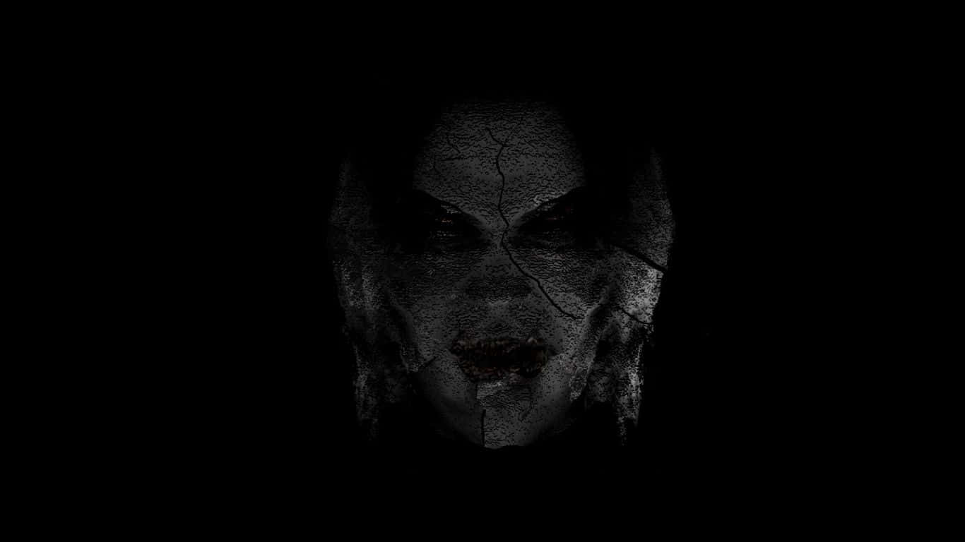 Dark Spirit 桌布 壁紙 — 一張破裂的鬼臉從黑暗中浮現，帶著發光的眼睛和邪惡的笑容。