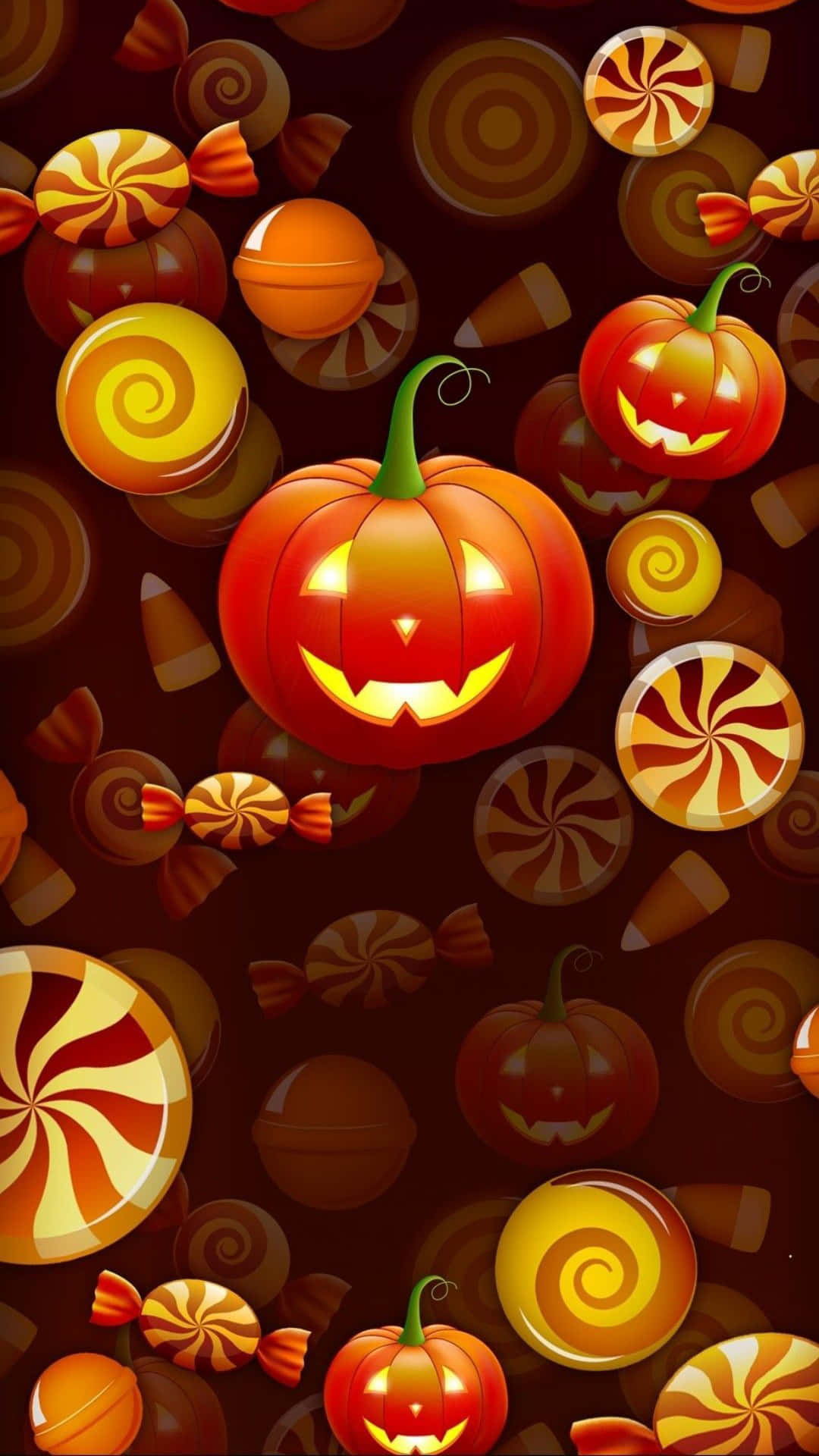 Jack O Lantern 桌布 壁紙 — 一張節日氣氛的萬聖節桌布，特色是發光的傑克南瓜燈和漩渦糖果在黑暗背景上漂浮。