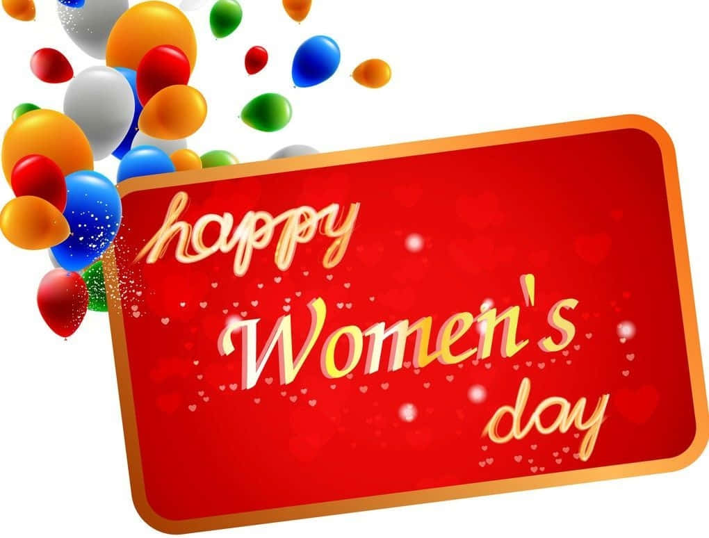 Greetings 桌布 壁紙 — 一張節日紅色卡片，金色草書文字寫著「happy Women's day」，周圍環繞著彩色氣球，背景為白色。