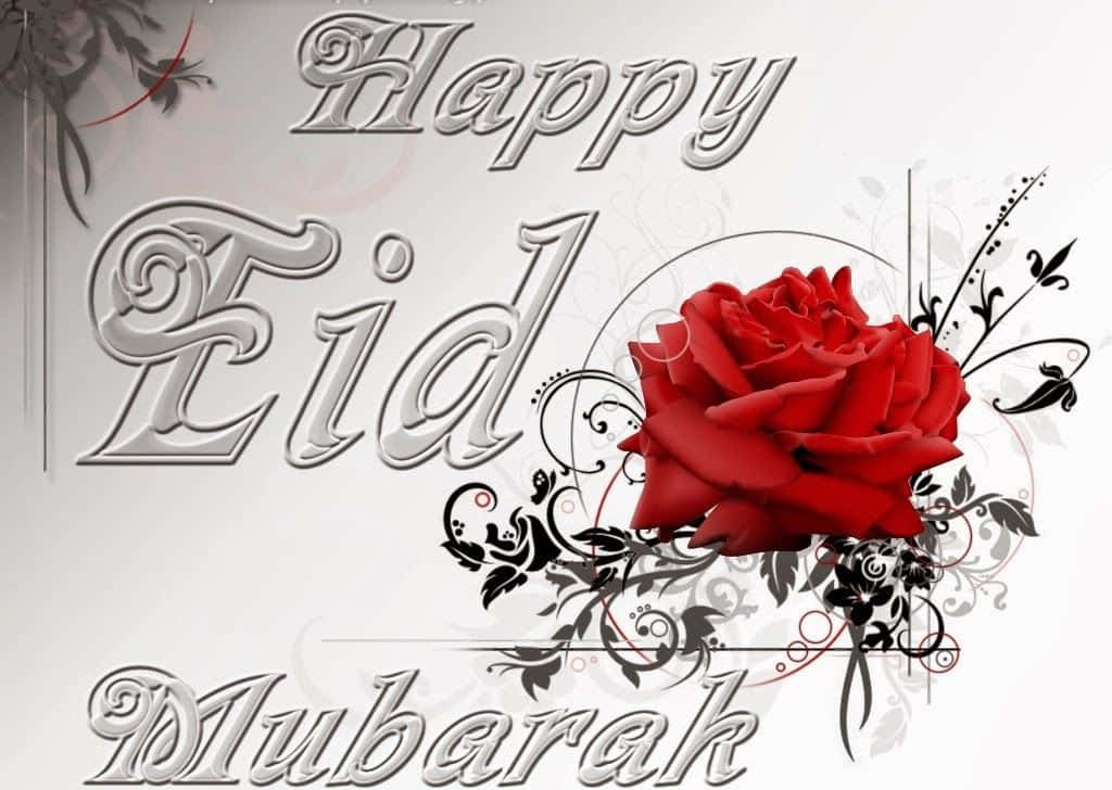 Eid Mubarak 桌布 壁紙 — 一張節日賀卡，淺色背景上帶有優雅的銀色字體寫著「Happy Eid Mubarak」，旁邊襯托著一朵鮮紅玫瑰和華麗的黑色漩渦圖案。