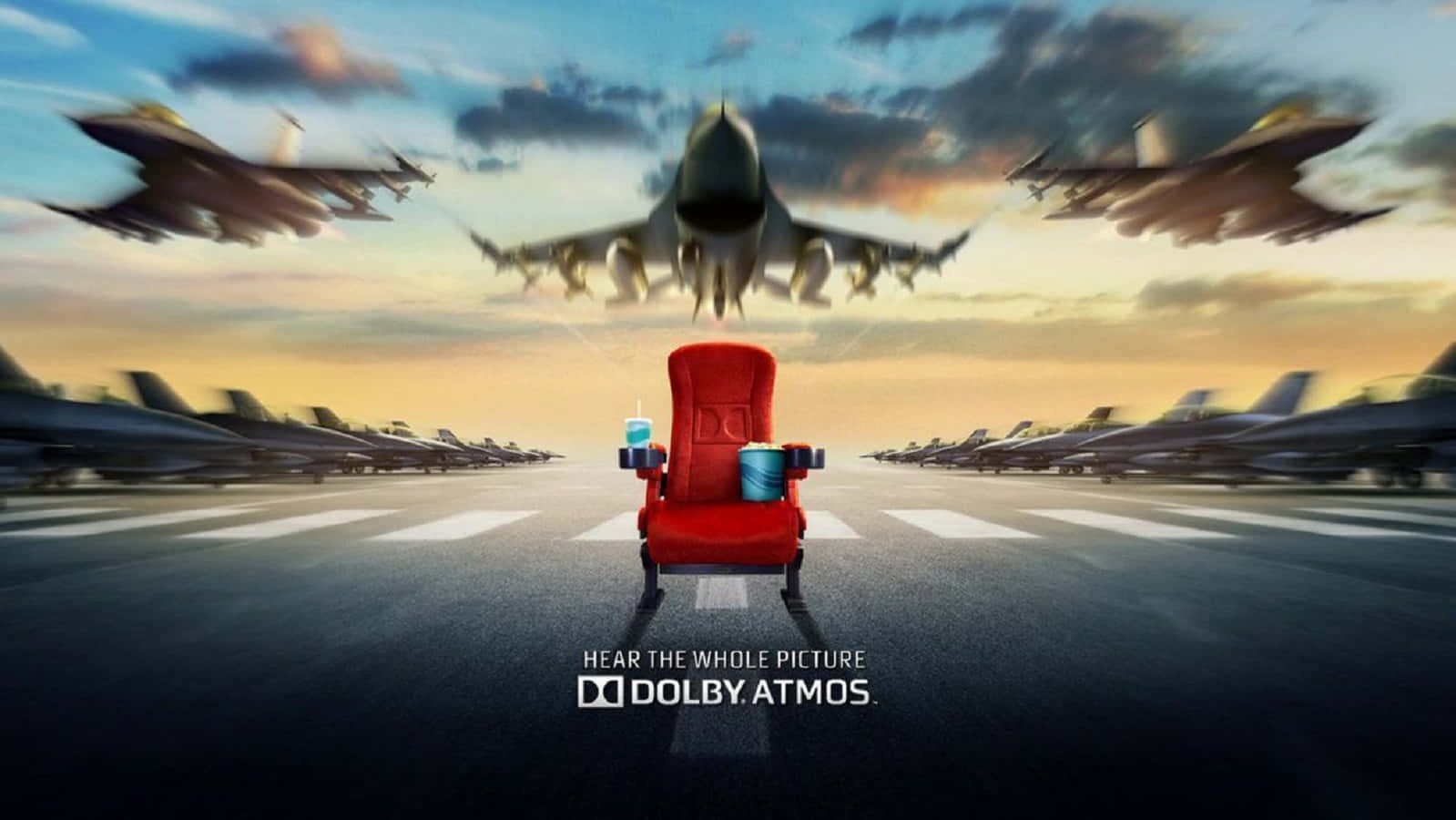 Dolby Digital 桌布 壁紙 — 一張紅色電影院座椅位於機場停機坪中央，戰鬥機在夕陽天空下呼嘯而過。