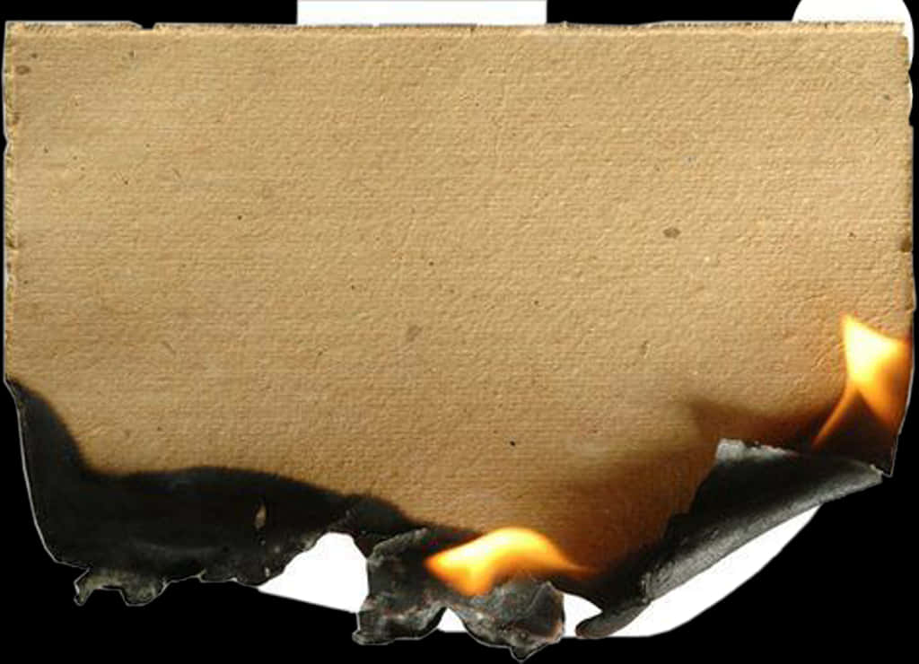 Parchment 桌布 壁紙 — 一張紙板底部燃燒的特寫，帶有橙色火焰和黑色燒焦邊緣，背景為黑色。