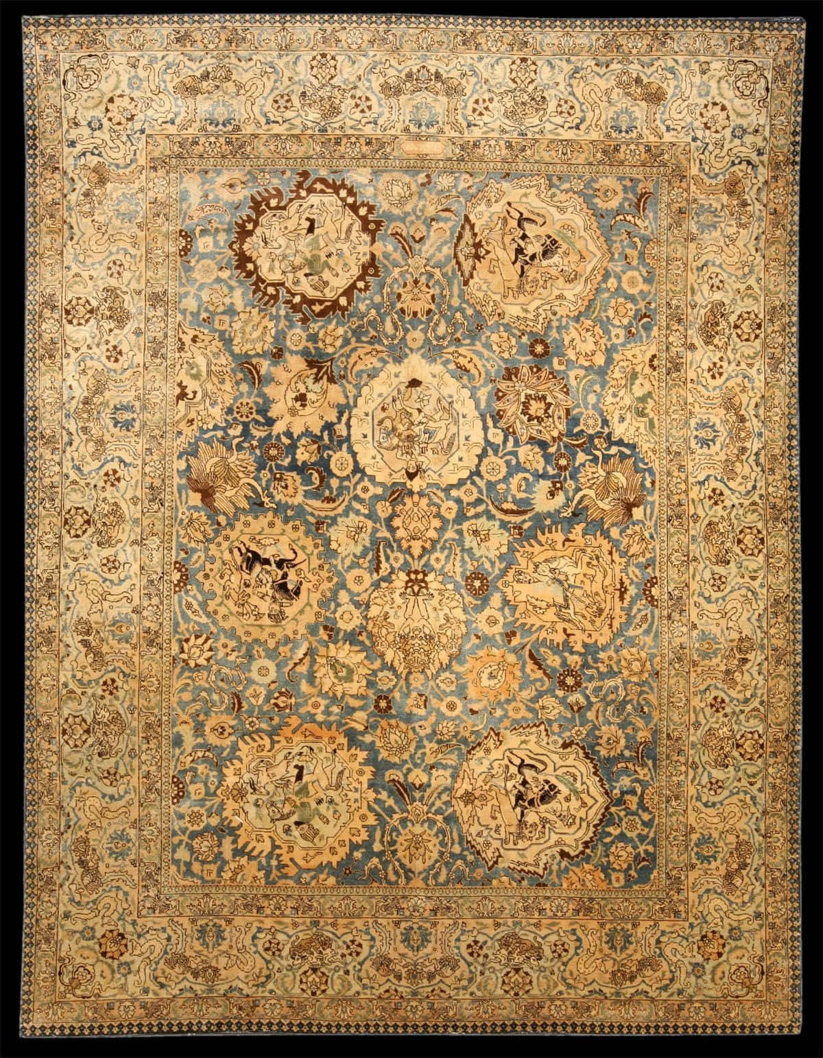 Carpet 桌布 壁紙 — 一張裝飾華麗的復古波斯地毯，帶有藍色、米色和金色色調的複雜花卉和獎章圖案。