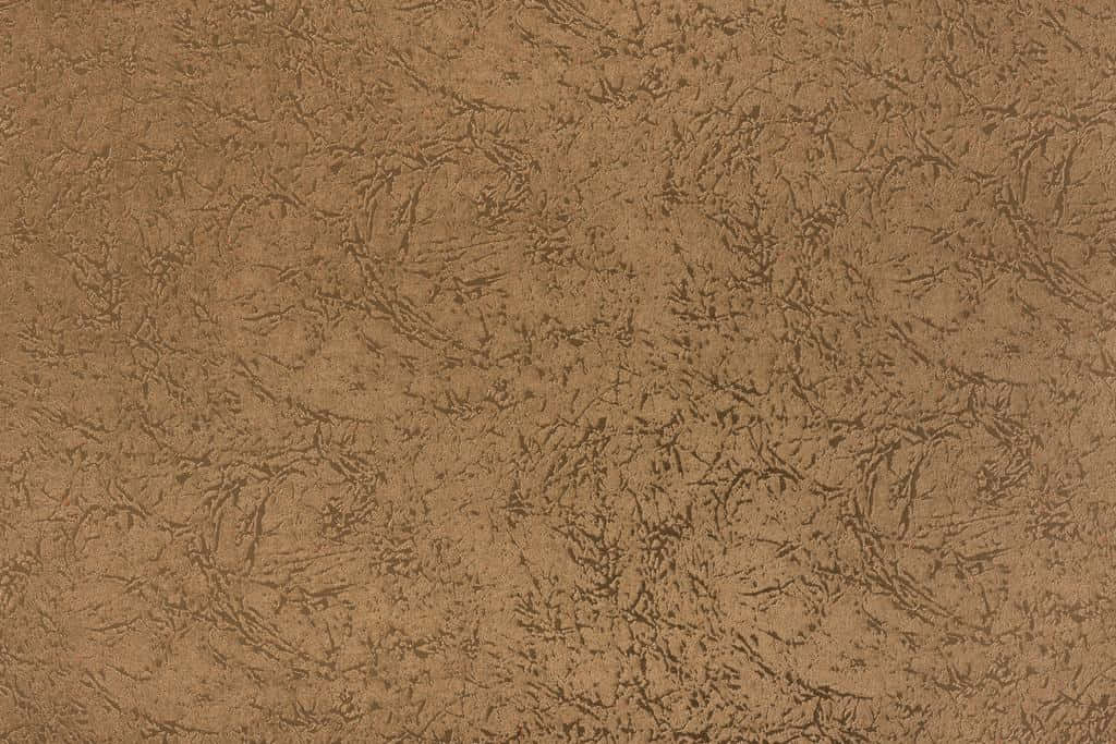 Brown Texture 桌布 壁紙 — 一張豐富棕色紋理壁紙的特寫，帶有複雜的漩渦圖案和微妙的色調變化。