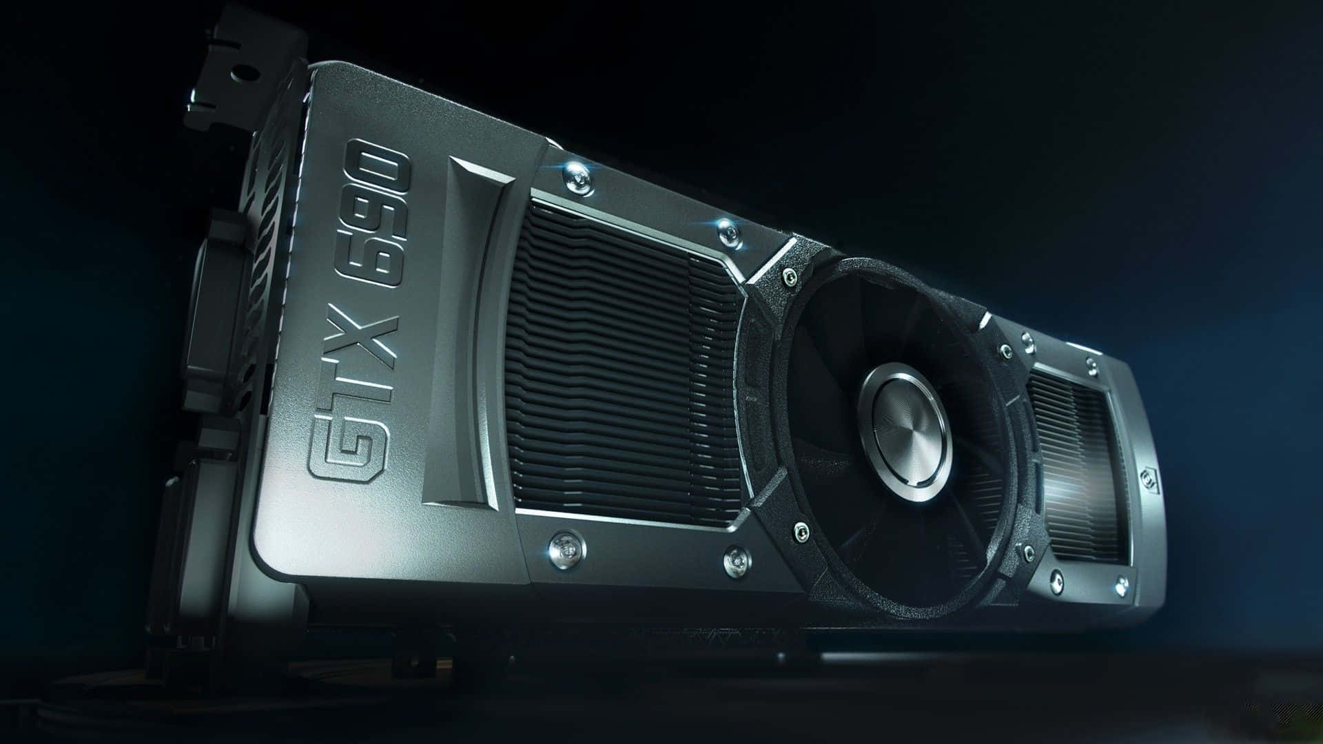 4K Graphics Cards 桌布 壁紙 — 一張銀色 GTX 690 顯示卡在戲劇性的暗光下傾斜擺放，帶有發光的藍色背景。