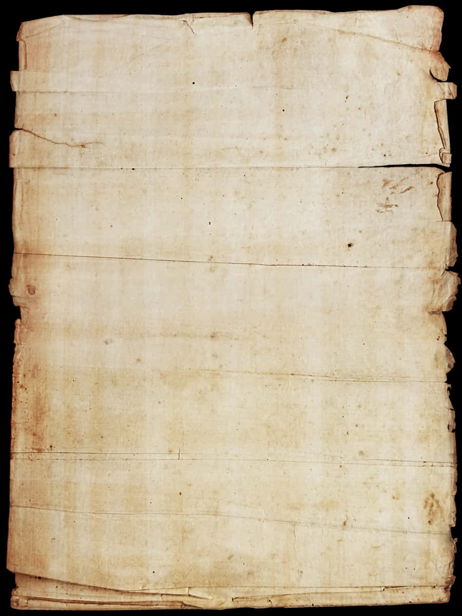 Old Paper 桌布 壁紙 — 一張陳舊的羊皮紙頁面，帶有可見的摺痕、污漬和破損邊緣，置於黑色背景上。