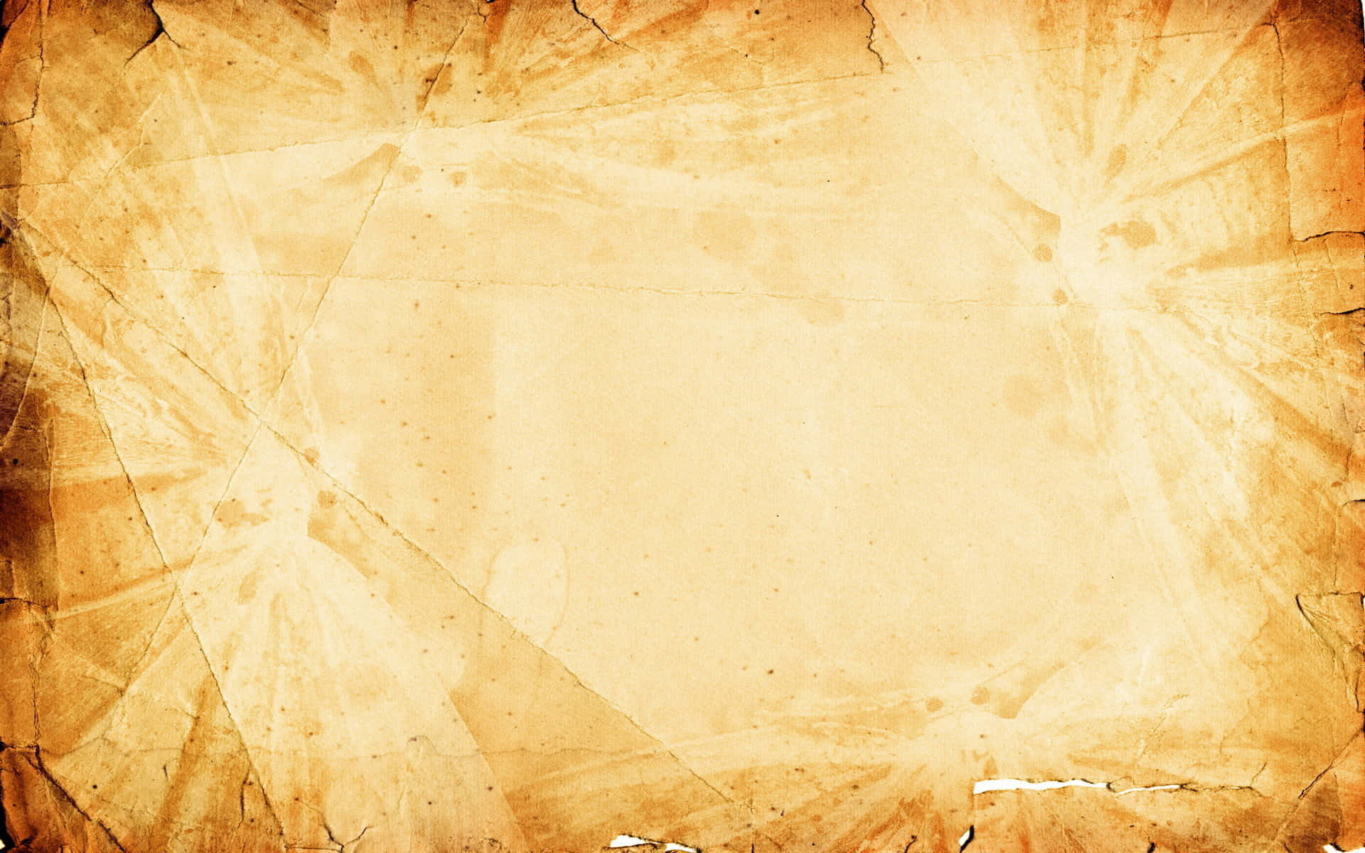 Old Paper Texture 桌布 壁紙 — 一張風化的復古羊皮紙，邊緣破裂，褪色的旭日圖案從角落向外輻射。