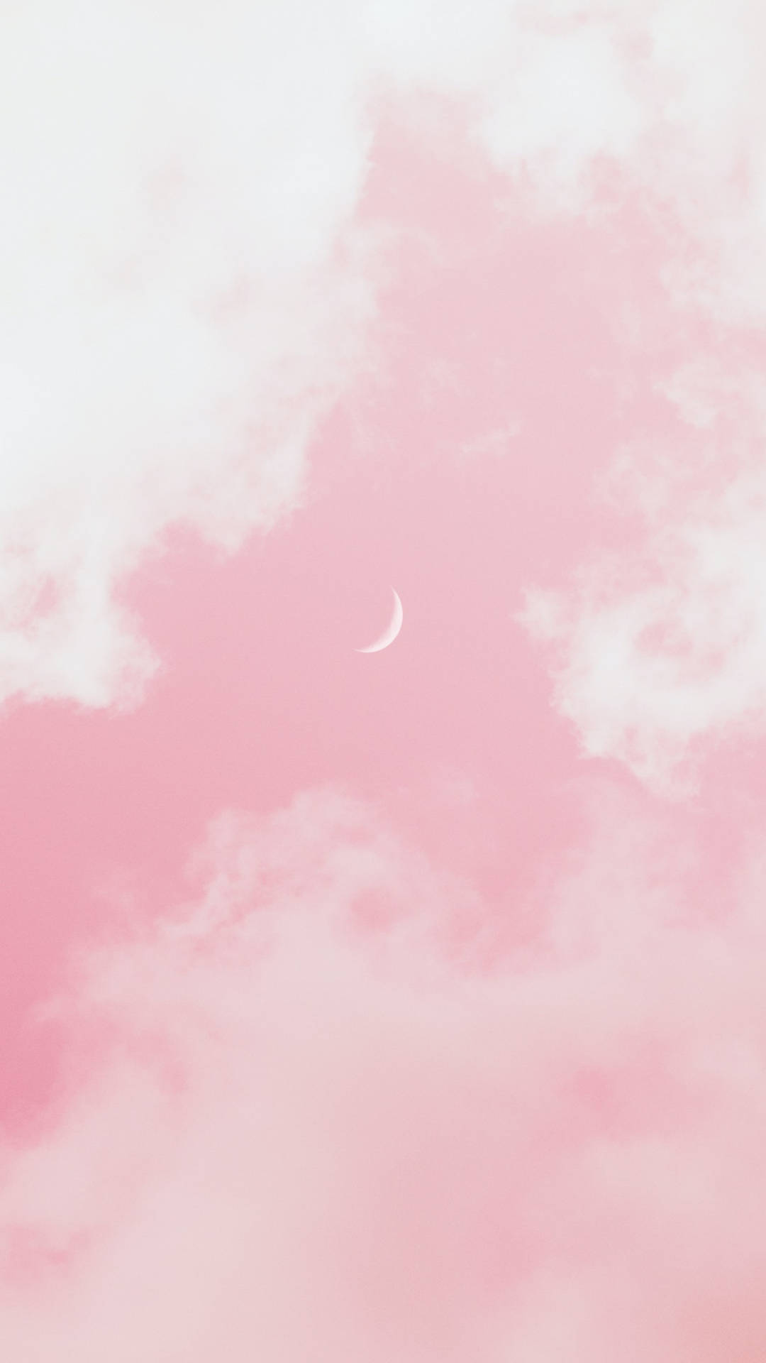Moon Aesthetic 桌布 壁紙 — 一彎精緻的月牙在夢幻的粉紅色天空中柔和發光，天空點綴著蓬鬆的白雲。