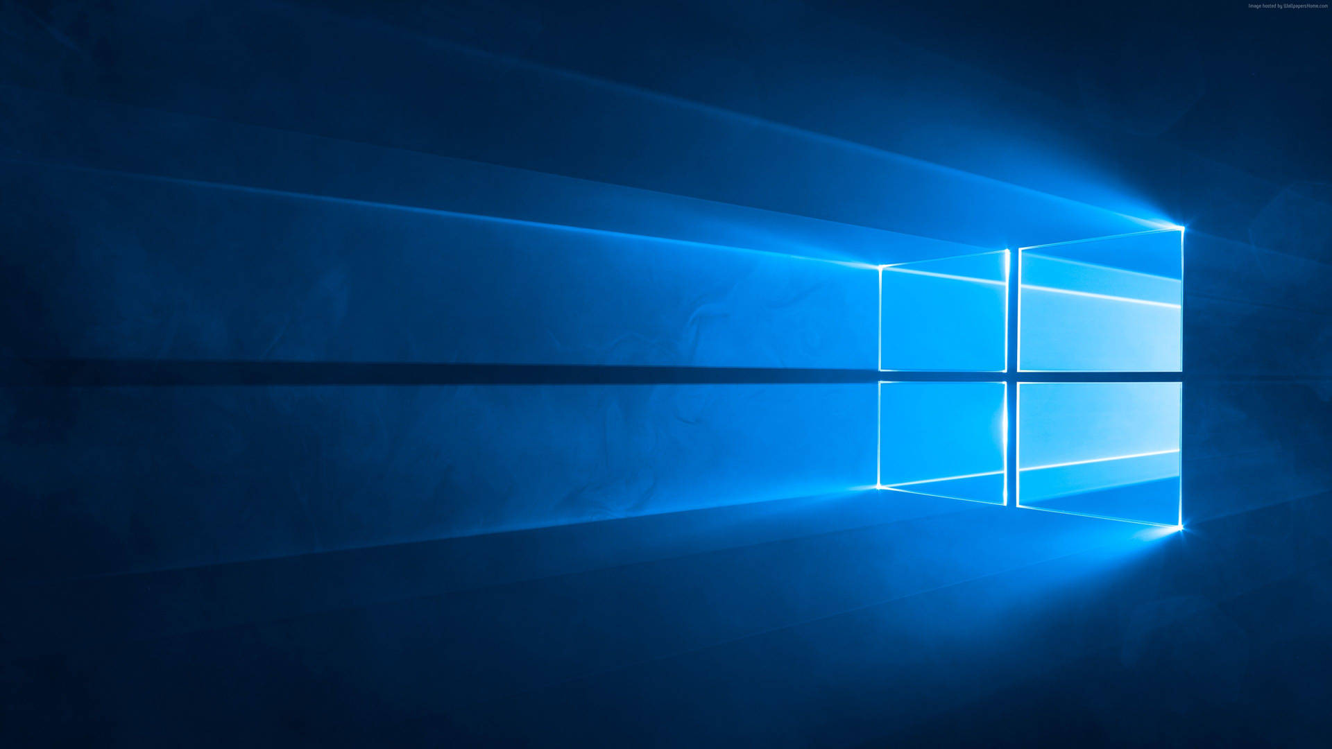 在黑暗的抽象數位場景中發出光束的藍色窗戶。 — Microsoft 壁紙