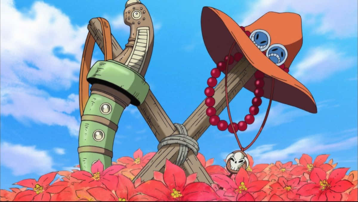 One Piece Ace's Death 桌布 壁紙 — 一把劍和帶有護目鏡和紅色珠子的草帽放在鮮豔的紅色花朵上，上方是明亮的藍天。