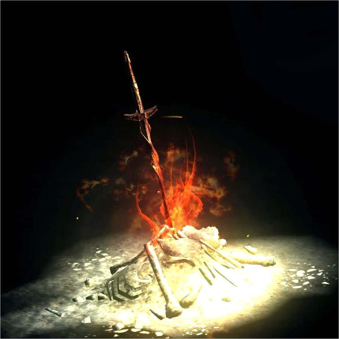 Dark Souls Bonfire 桌布 壁紙 — 一把生鏽的劍在黑暗、熾熱的坑中燃燒在骨堆之上，向地面投射出詭異的光芒。