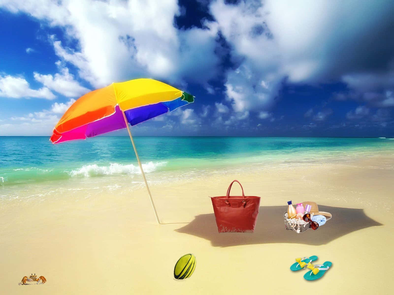 Beach Accessories 桌布 壁紙 — 一把鮮豔的彩虹沙灘傘在戲劇性的藍天下，為金色沙灘上的一個紅色袋子和人字拖遮蔭，旁邊是碧綠色的海浪。