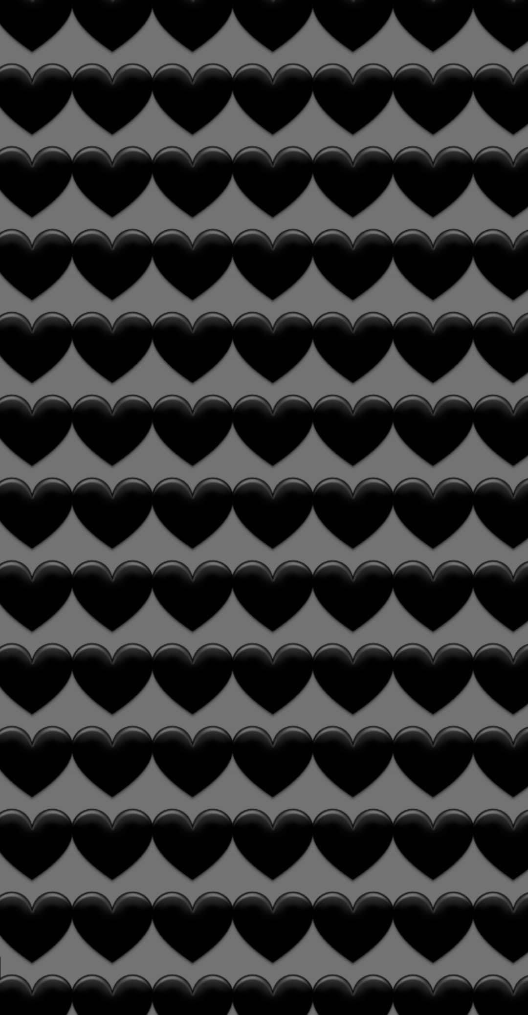 Black Emoji 桌布 壁紙 — 一排排光滑的黑色心形在柔和的灰色背景上以密集的網格重複排列。