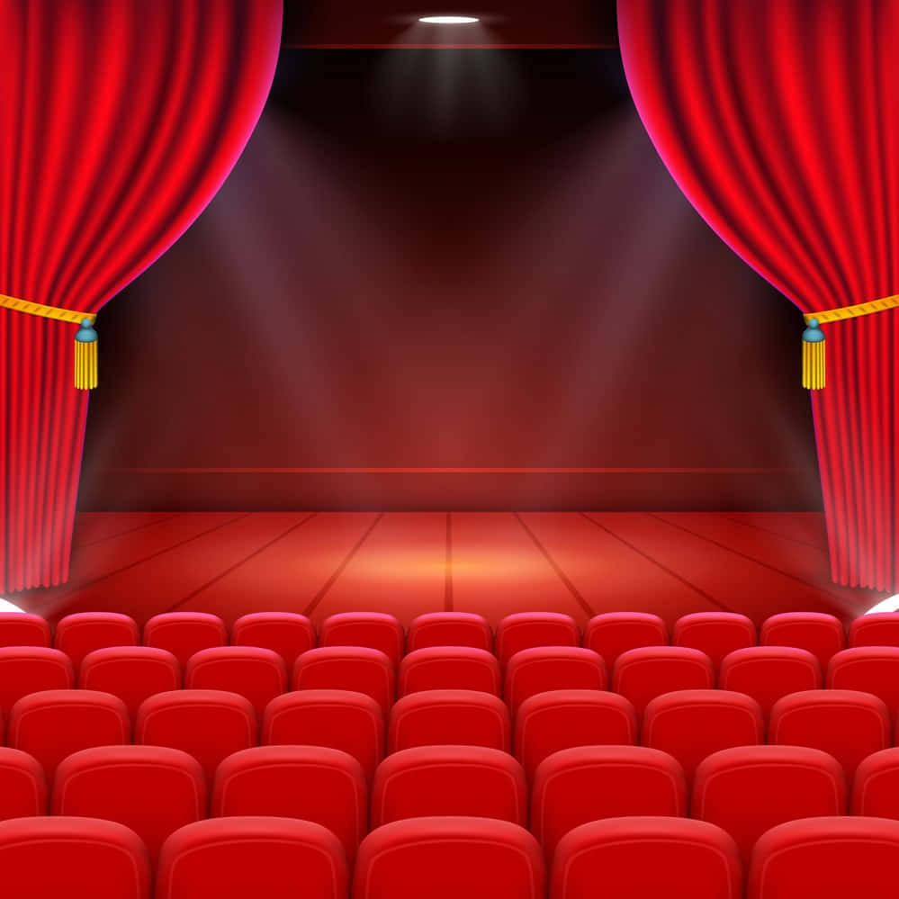 cinema 桌布 壁紙 — 一排排紅色劇院座位面向舞台，紅色窗簾被聚光燈分開。