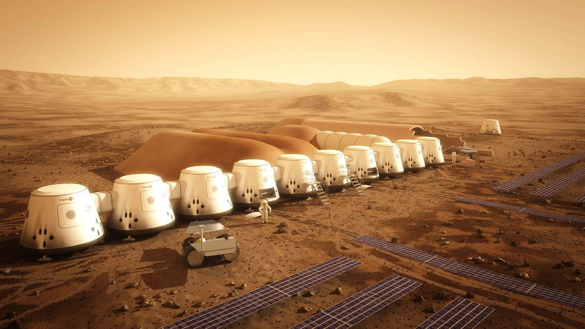 The Martian 桌布 壁紙 — 一排白色圓頂棲息地和太陽能電池板點綴在火星鏽紅色的平原上，天空是朦朧的橙色。