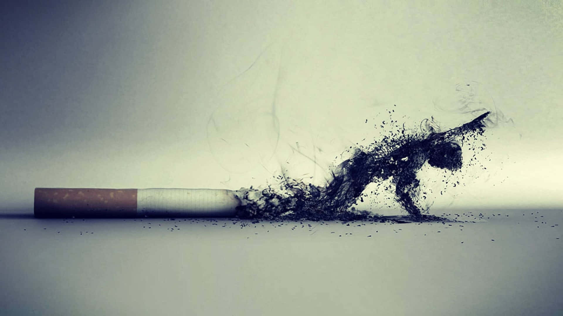Cool Smoke 桌布 壁紙 — 一支香煙冒煙，其煙灰轉化為人形，在暗淡背景中分解成粒子。