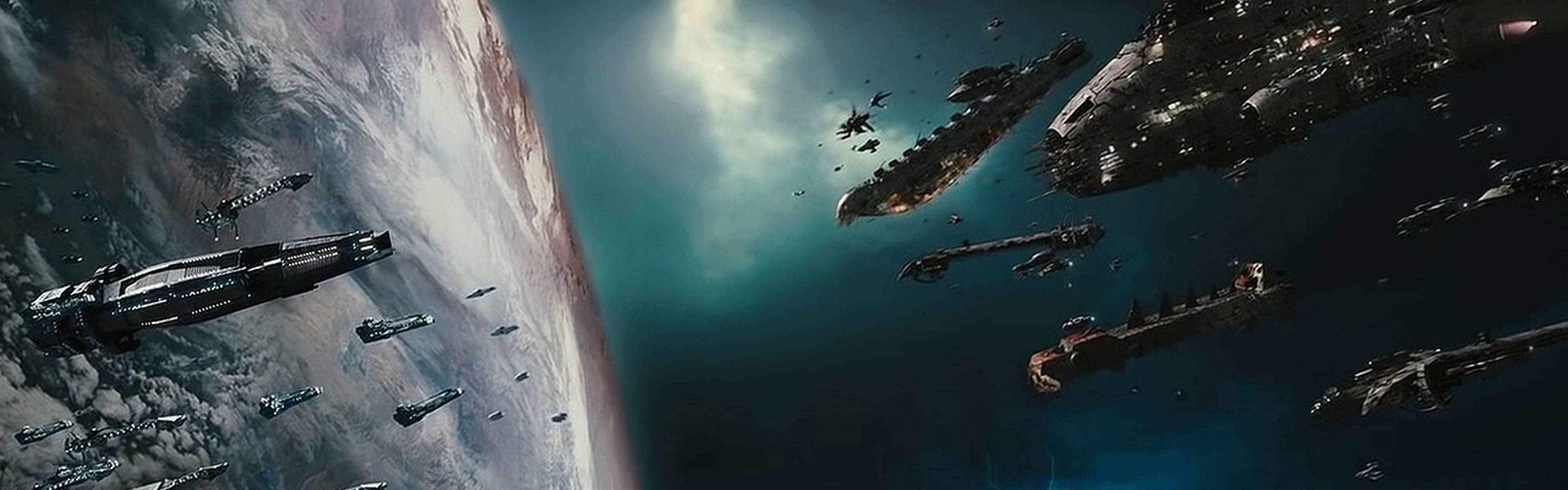Screen 桌布 壁紙 — 一支龐大的戰艦艦隊在發光的天空下，於行星彎曲的地平線上方戰鬥。