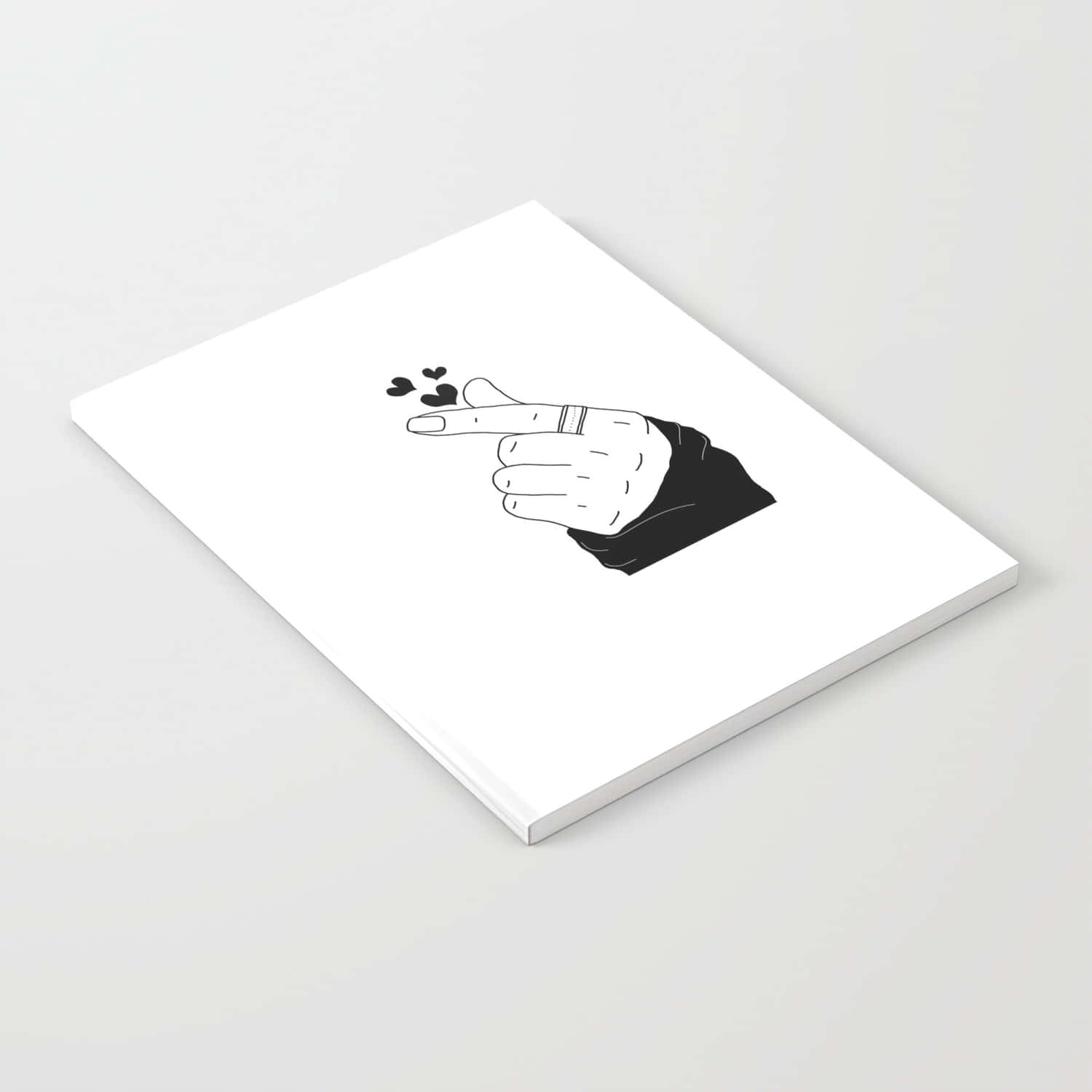 Finger Heart 桌布 壁紙 — 一本極簡筆記本，上面有黑白線條畫，畫著一隻手指向，食指飄出愛心。