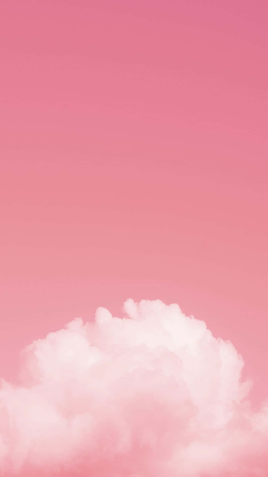 Clouds Aesthetic Tumblr 桌布 壁紙 — 一朵柔軟蓬鬆的雲在漸變粉紅色的天空中飄移，形成極簡數位桌布。
