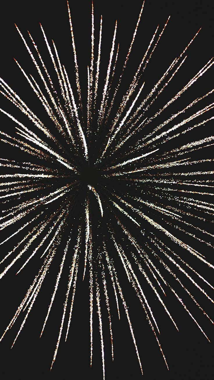 Fireworks 桌布 壁紙 — 一束耀眼的金色煙火在漆黑的夜空中綻放成燦爛的條紋。