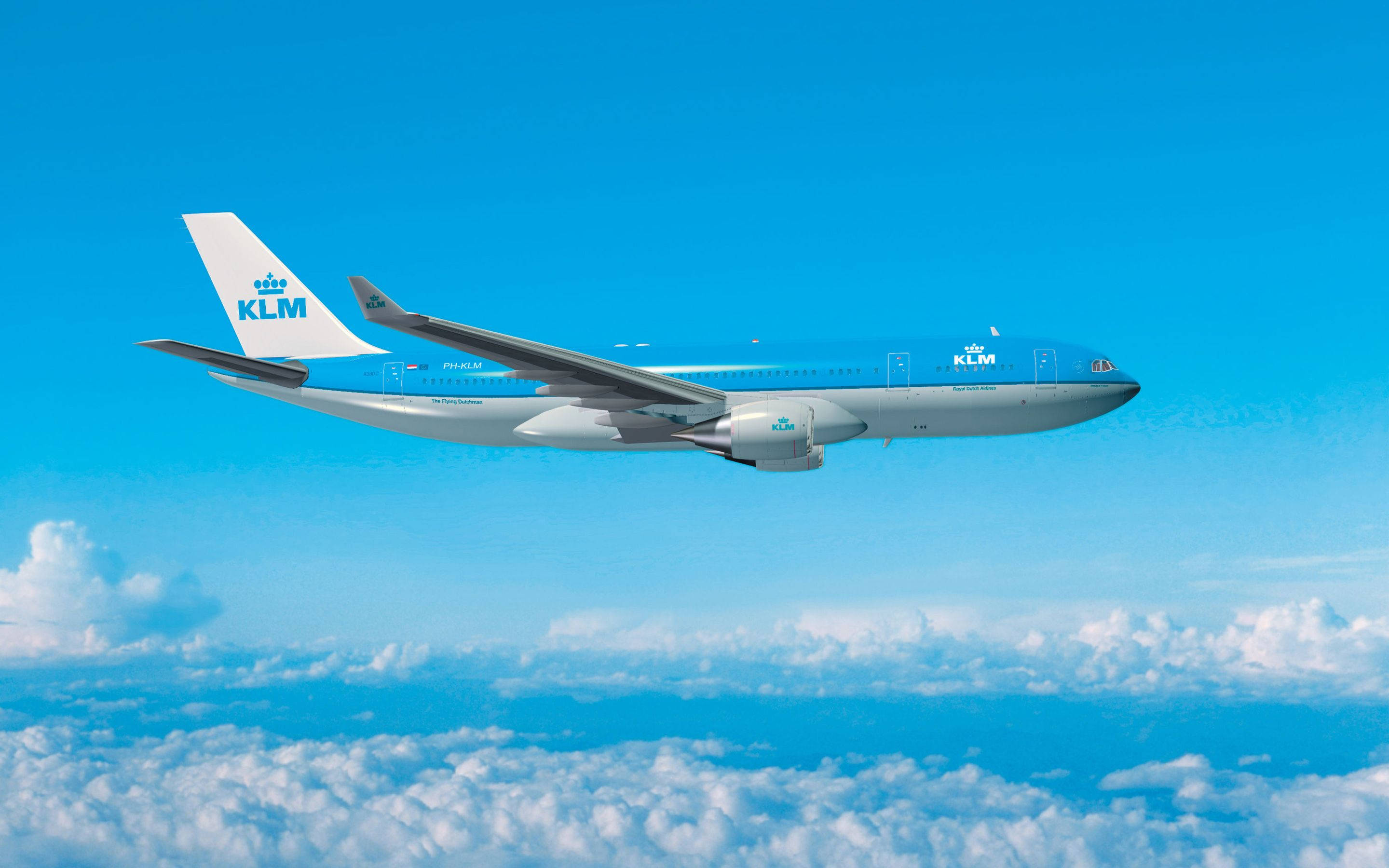 飛機 桌布 壁紙 — 一架KLM飛機在湛藍天空下優雅地翱翔於蓬鬆的白雲之上。