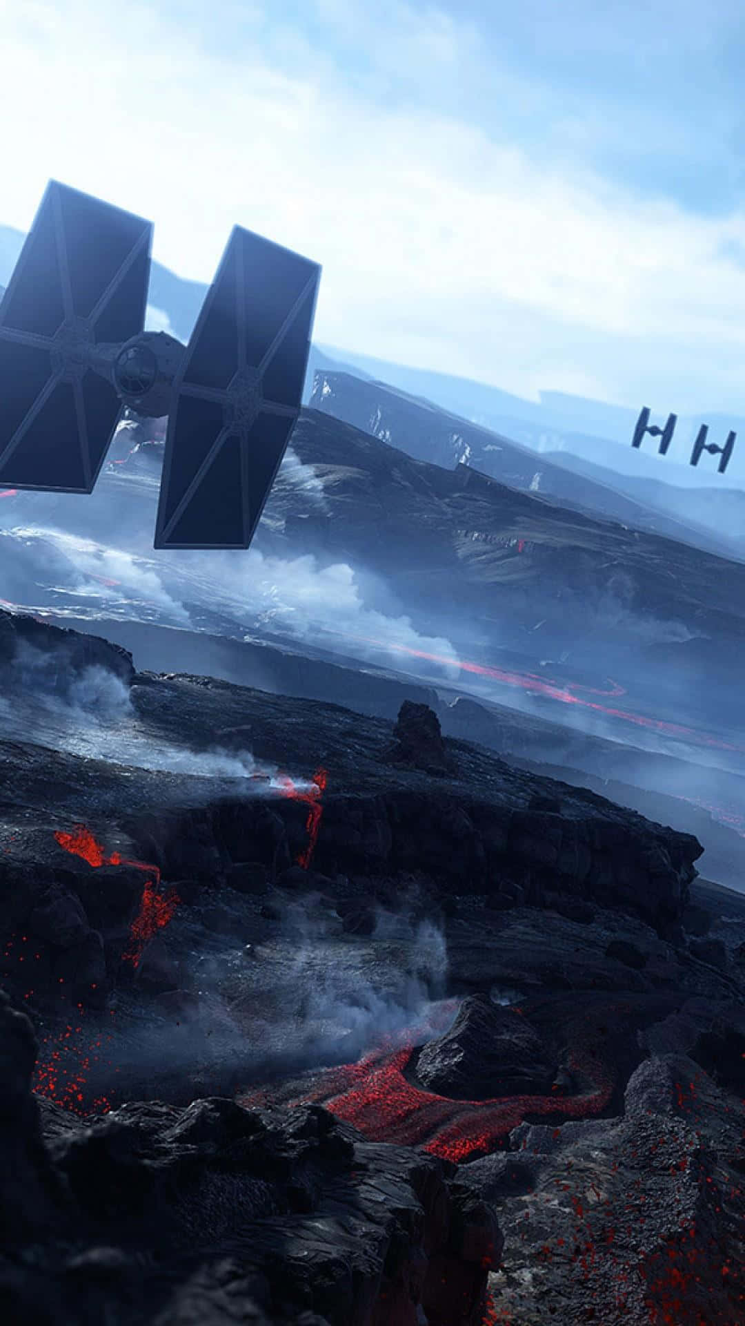 Star Wars Phone 桌布 壁紙 — 一架TIE戰機在多雲的天空下，飛越一個有發光熔岩流和遠處帝國戰艦的火山地貌。