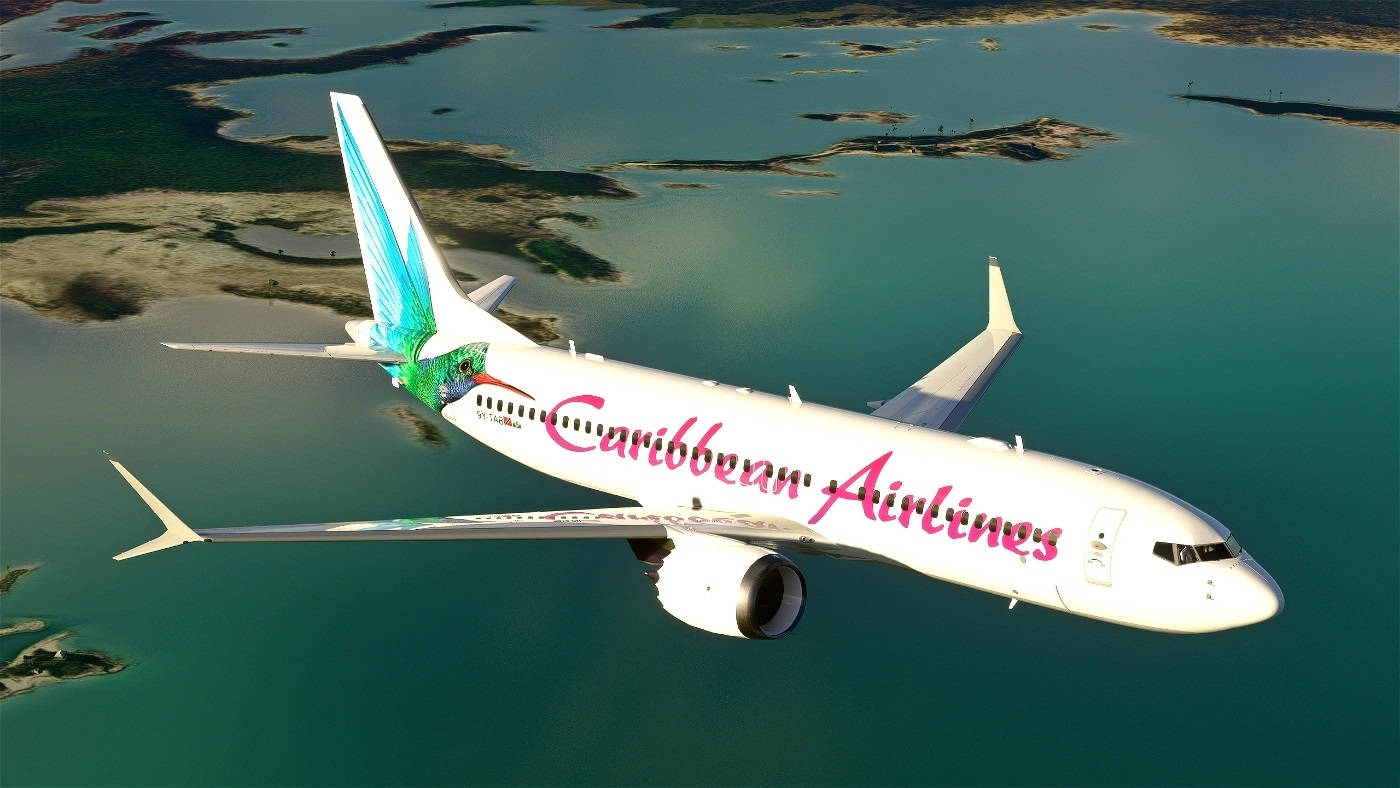 飛機 桌布 壁紙 — 一架加勒比航空的飛機在碧綠的海水和翠綠的島嶼上空優雅地翱翔。