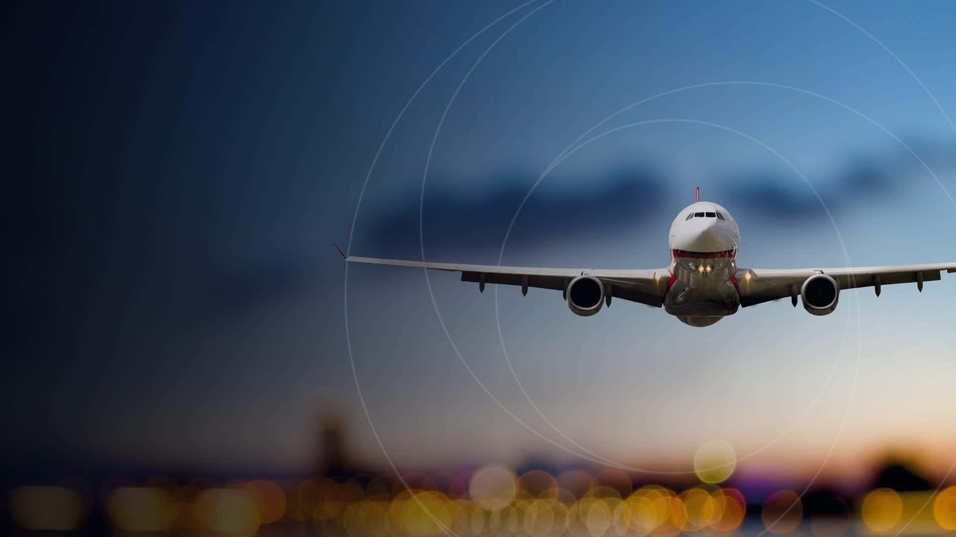 Flight 桌布 壁紙 — 一架商用飛機在暮色天空中飛過，下方是閃爍的城市燈光。