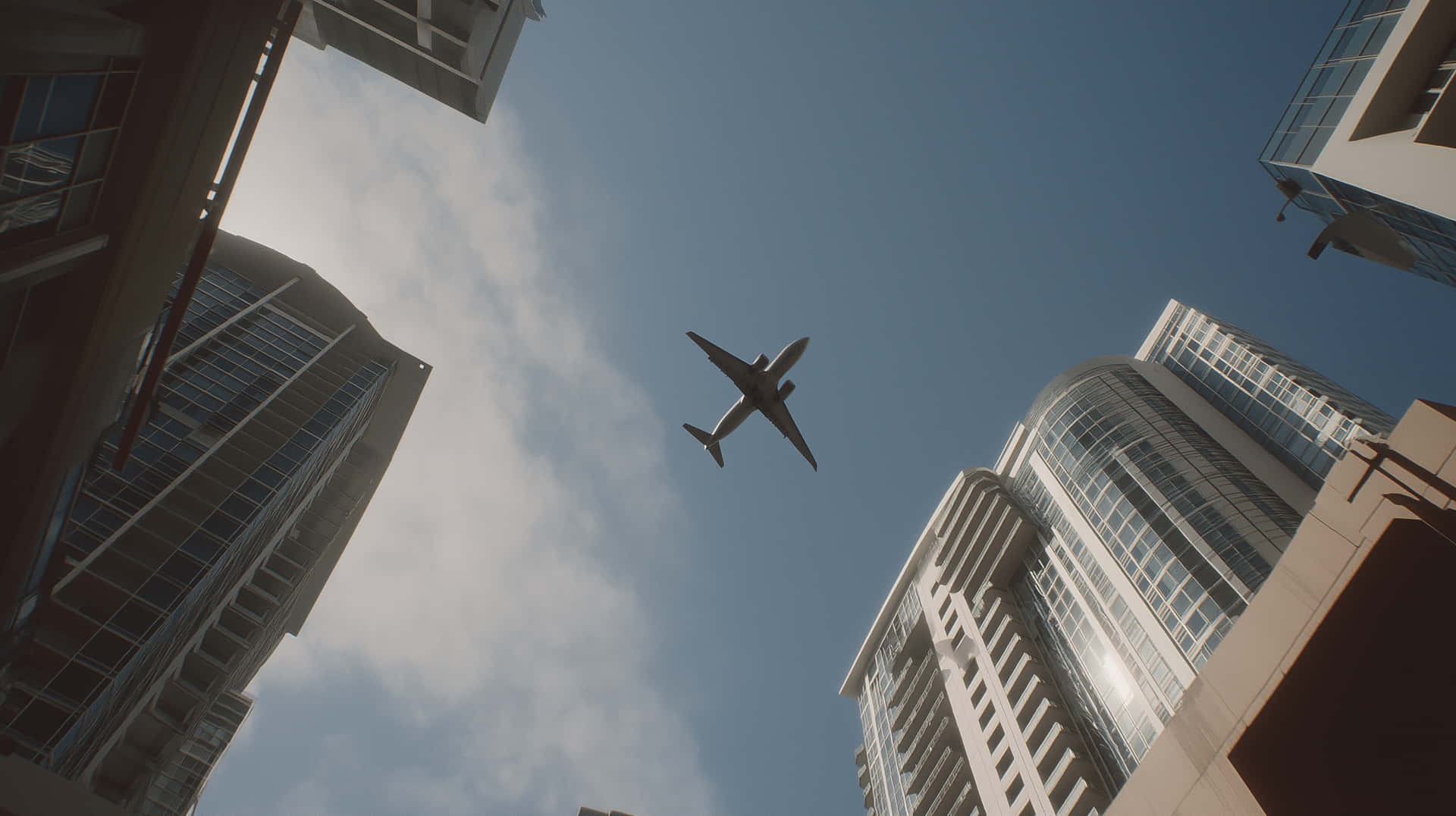 Cinematic View of a Plane Soaring Between Towering City Skyscrapers 壁紙 — 一架商用飛機在部分多雲的藍天下翱翔於高聳的玻璃摩天大樓之上。