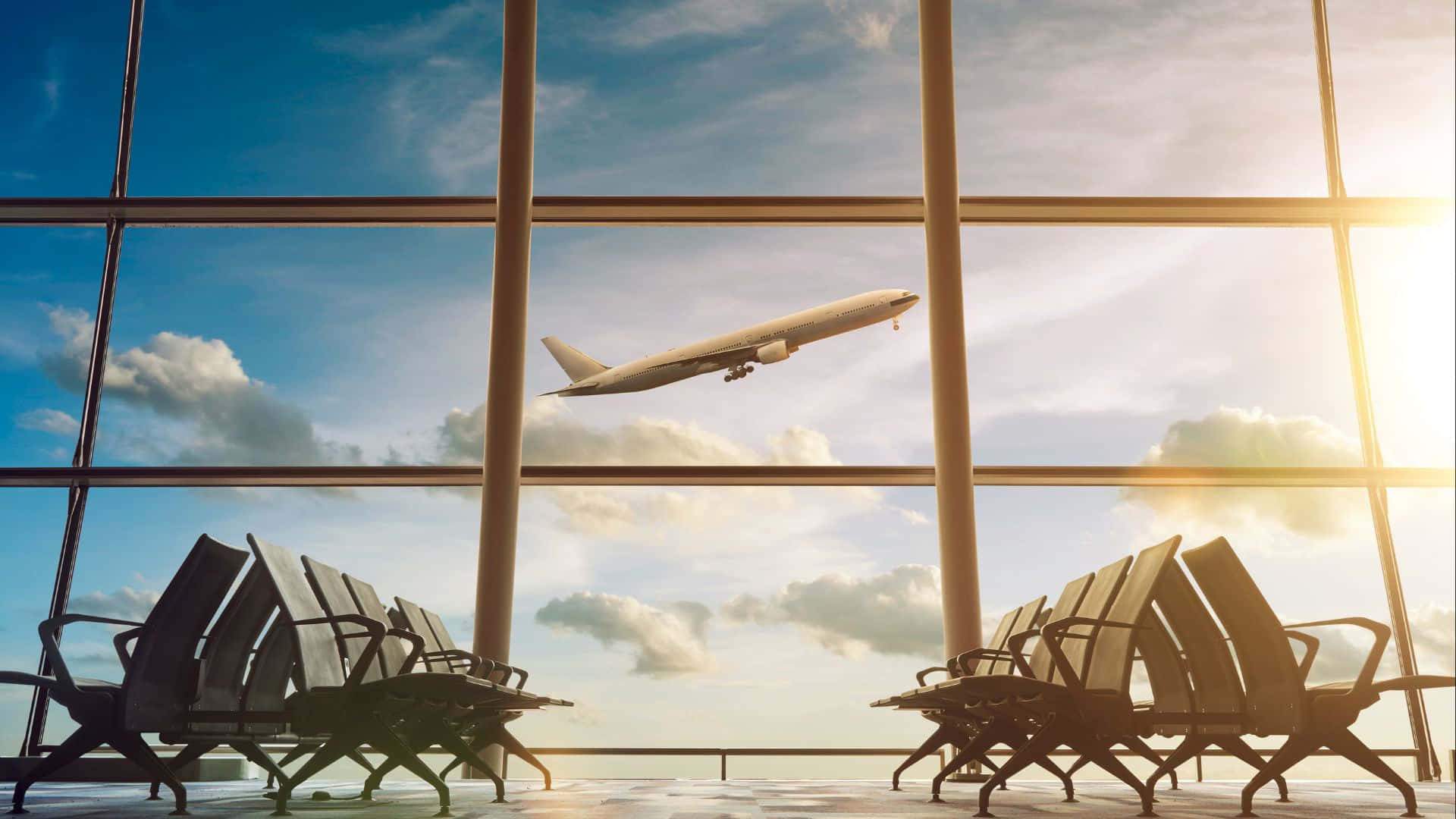 空蕩蕩的機場椅子面向大窗戶，飛機升入晴朗的天空。 — 飛機 壁紙