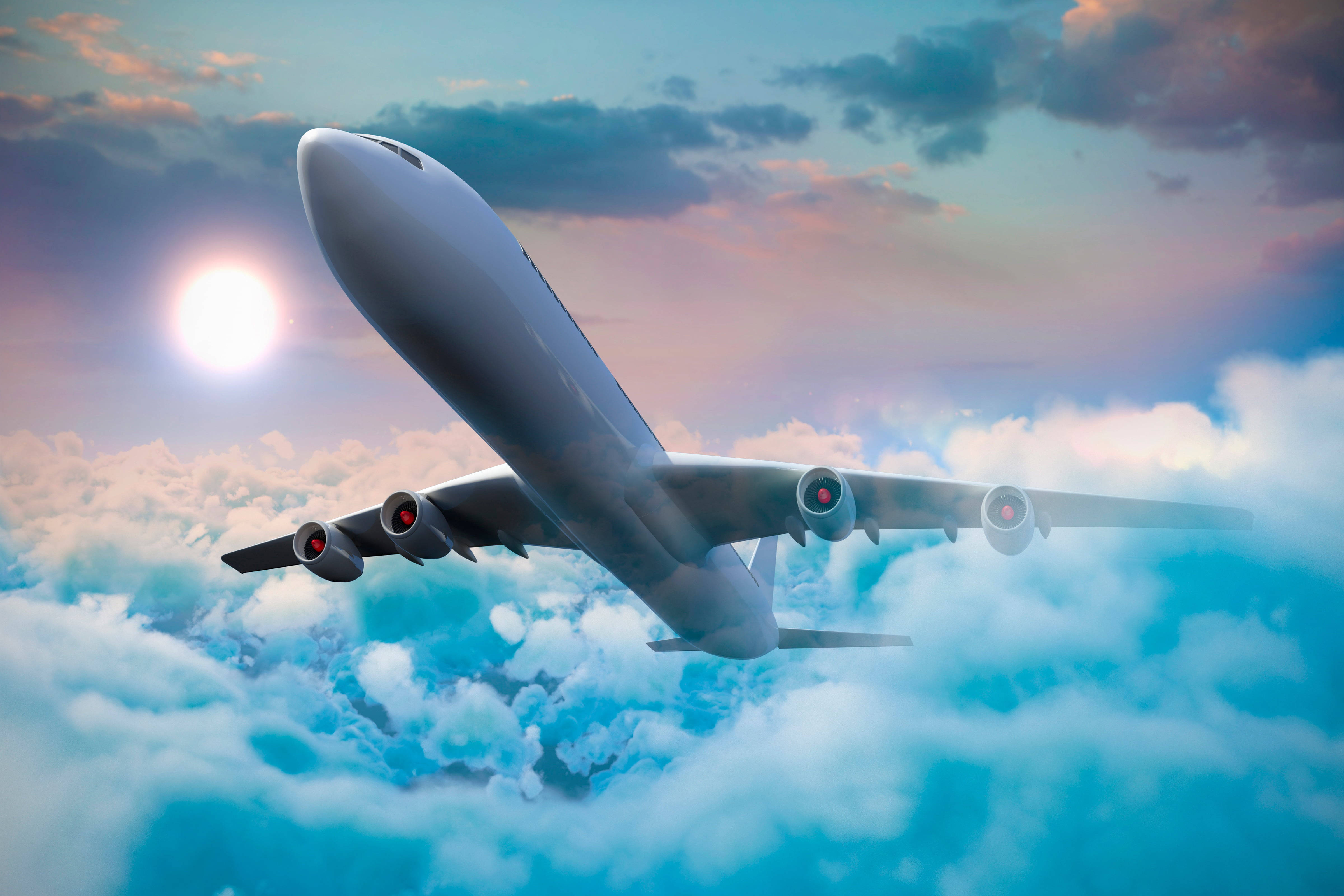 HD Plane 桌布 壁紙 — 一架大型客機在蓬鬆的白雲上方翱翔，明亮的太陽在粉彩色的天空中閃耀。