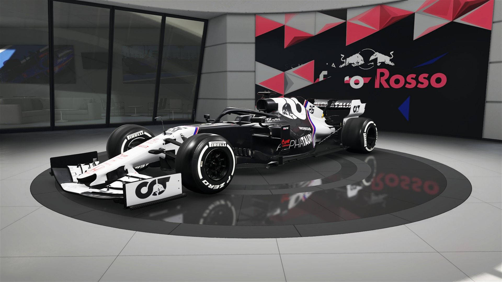 F1 桌布 壁紙 — 一架帶有 Red Bull Racing 品牌標誌的時尚黑白一級方程式賽車，在現代展廳的圓形平台上展示。