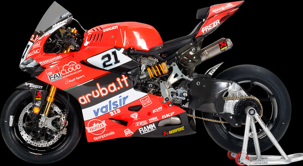 Bike HD 桌布 壁紙 — 一架帶有21號碼和贊助商貼紙的時尚紅色Ducati賽車摩托車，在黑色背景的支架上蓄勢待發。