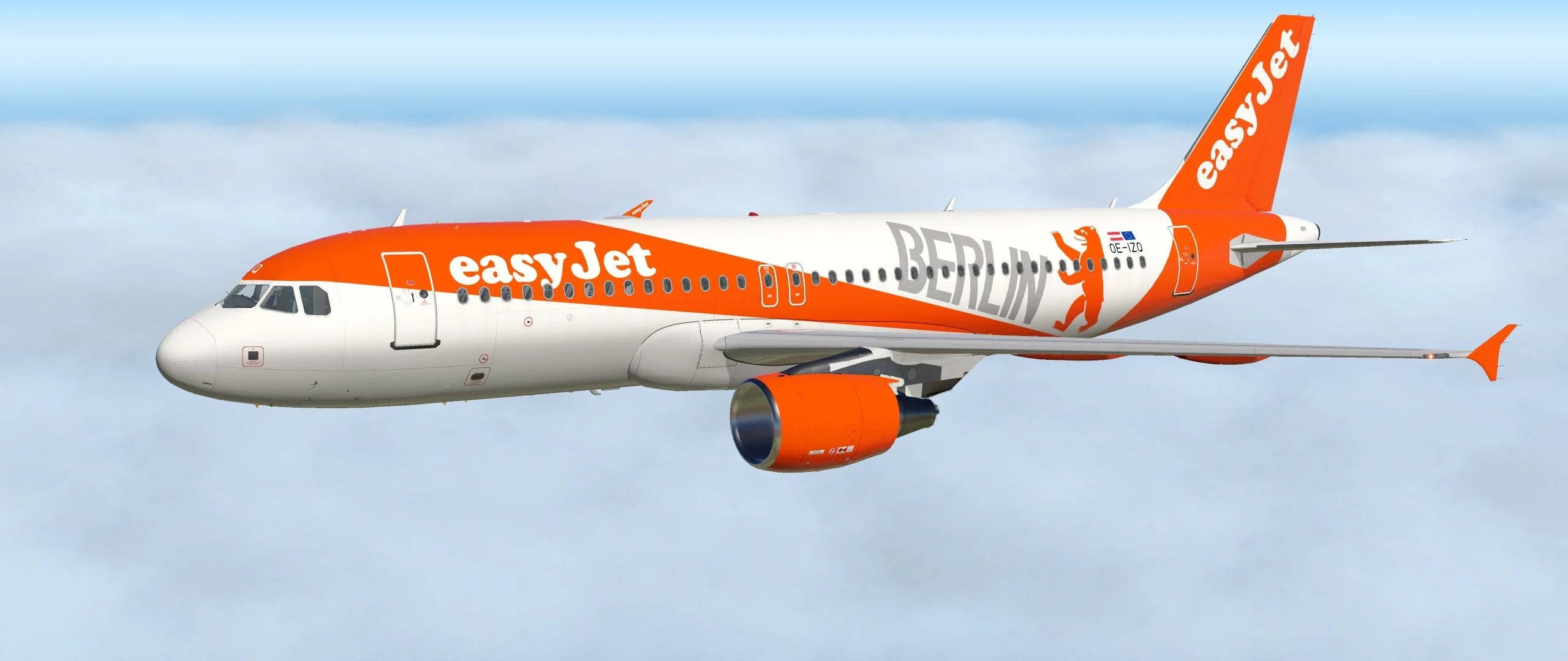 飛機 桌布 壁紙 — 一架帶有柏林塗裝的易捷航空空中巴士A320在晴朗藍天下翱翔於蓬鬆白雲之上。